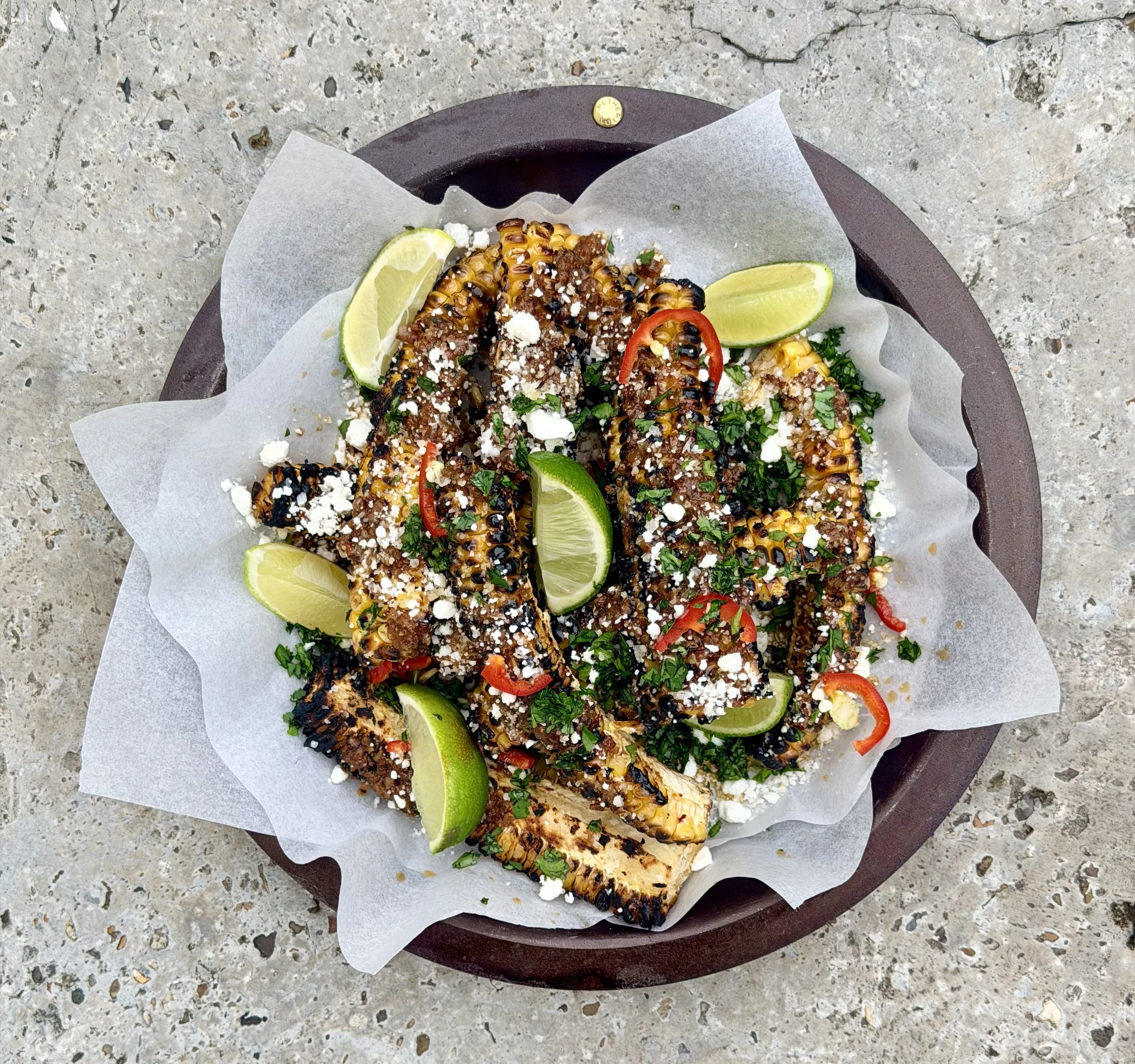 Blak eldur buttered corn ribs with feta, coriander and Aleppo chilli