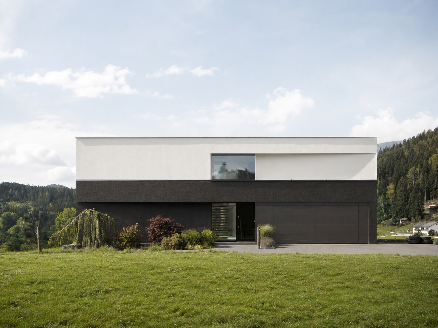 modern_minimalist_home_in_a_rural_landscape.png