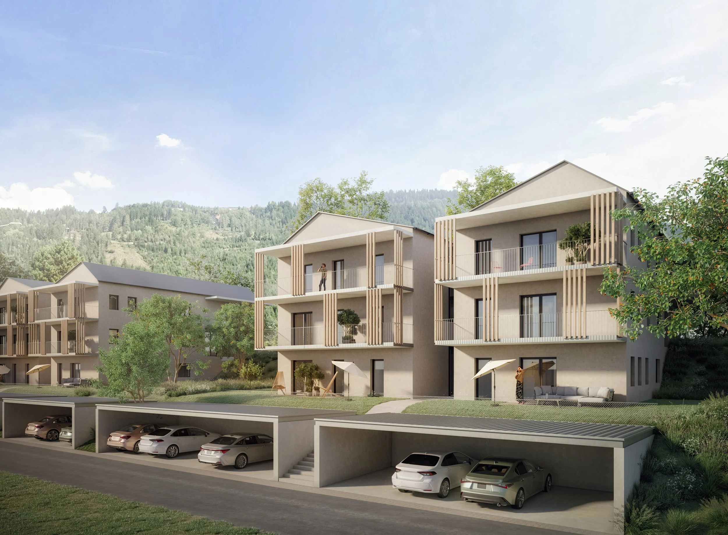 Modern multi-story residential buildings with balconies, surrounded by greenery and with a hillside in the background. There is a parking garage with several cars in the underground level.