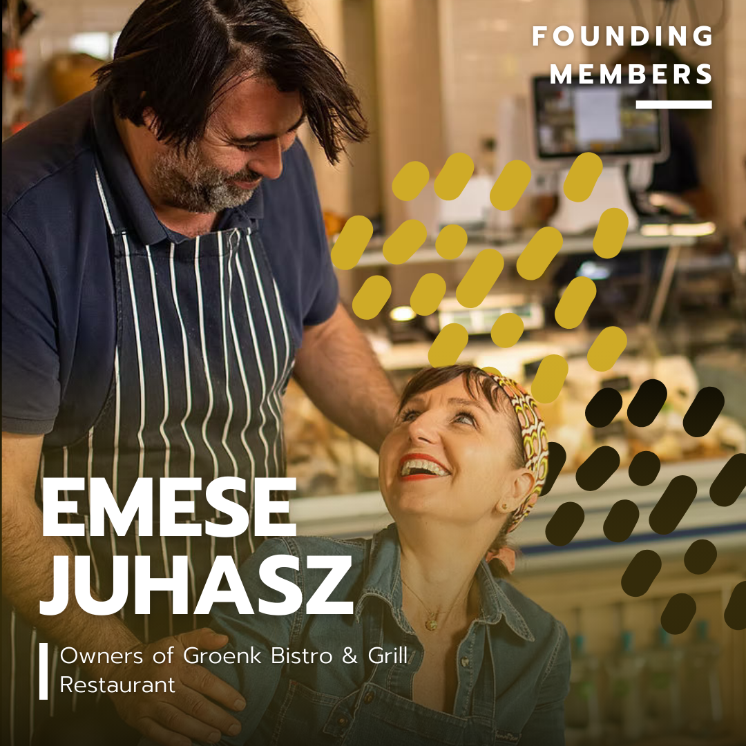 A man in a striped apron helping a woman with short hair and a colorful headband in a bistro or grill restaurant.