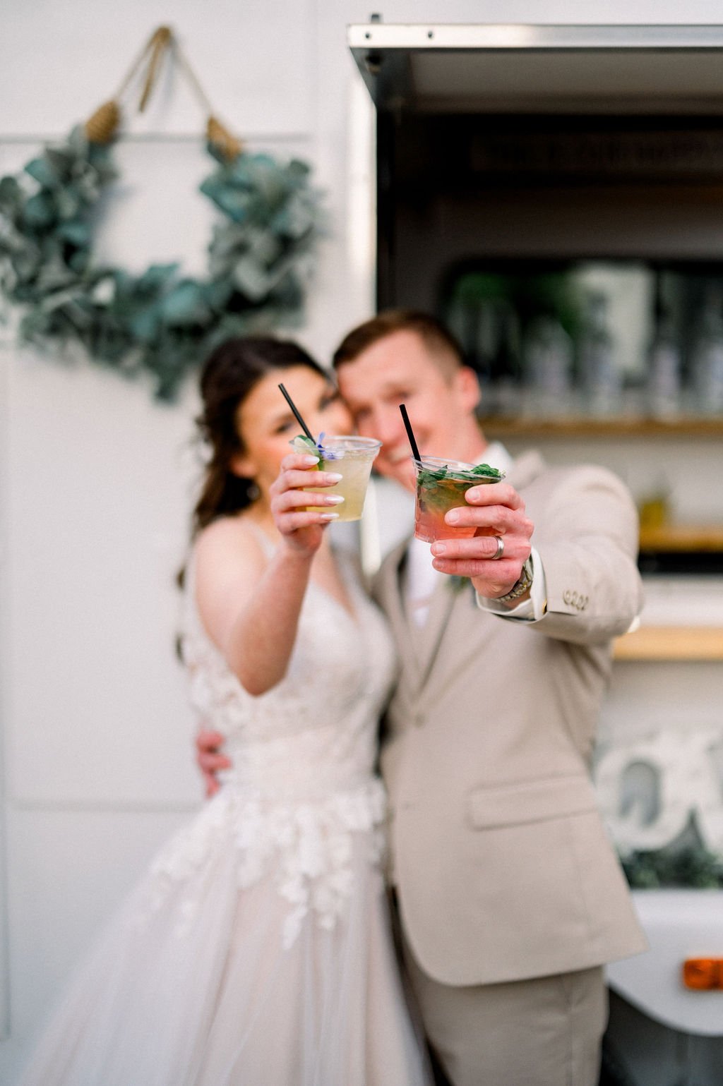 Newlyweds celebrating at their Knotty Barn wedding reception.