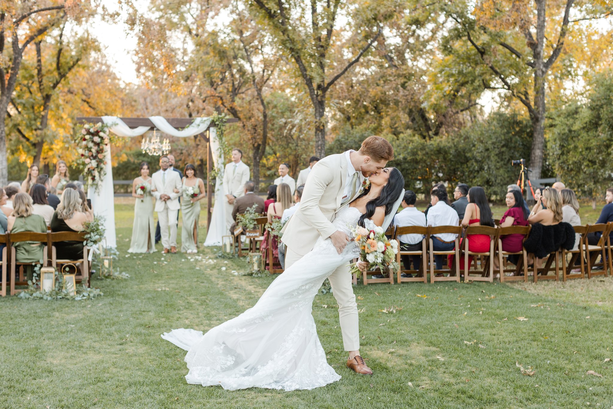 Bride and groom celebrating after their outdoor fall wedding ceremony at Venue at the Grove.