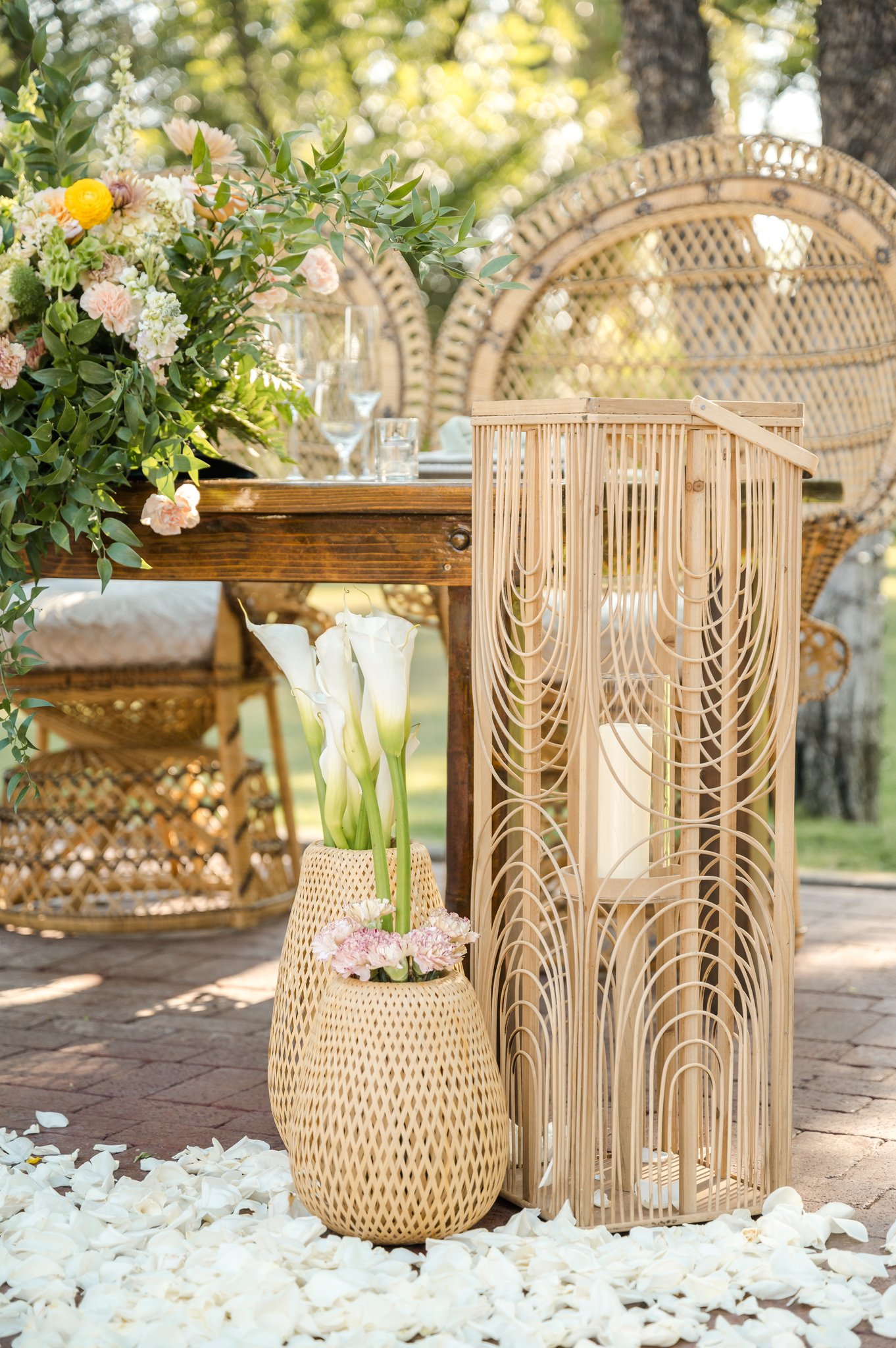 Wedding welcome display at Venue at the Grove decorated with soft peach, yellow, pink and lavender garden flowers.
