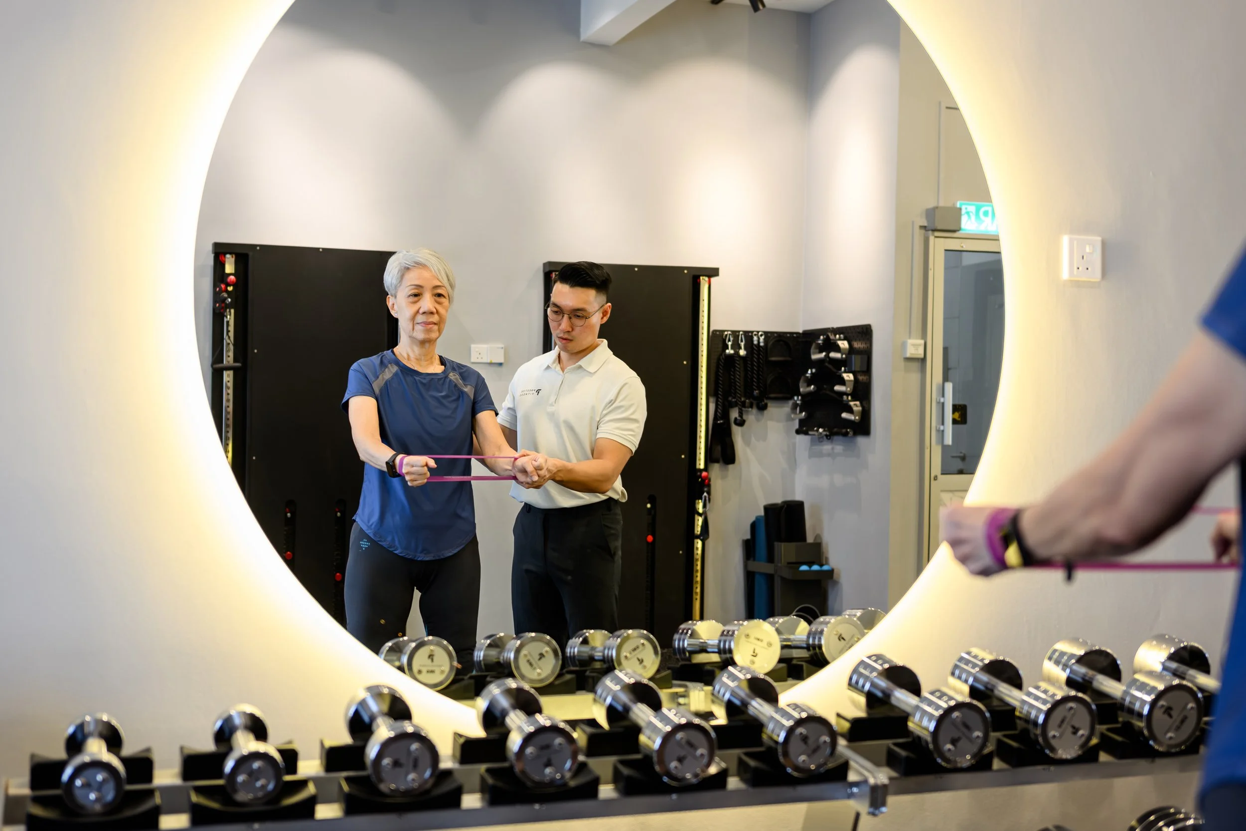 Private personal trainer in Ipoh guiding senior 1-to-1 strength and fitness training at Prestige Fitness Ipoh