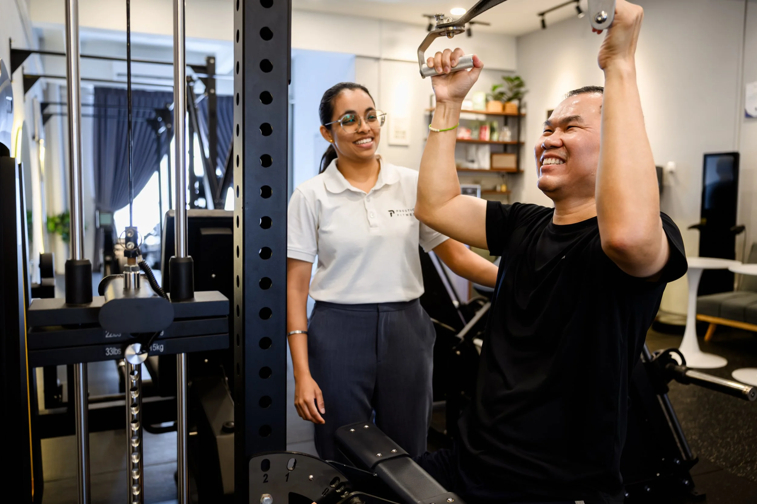 Best rated personal trainer in Ipoh, Keith Chung guiding two seniors strength and fitness training at Prestige Fitness with Semi Private Group Personal Training in Ipoh