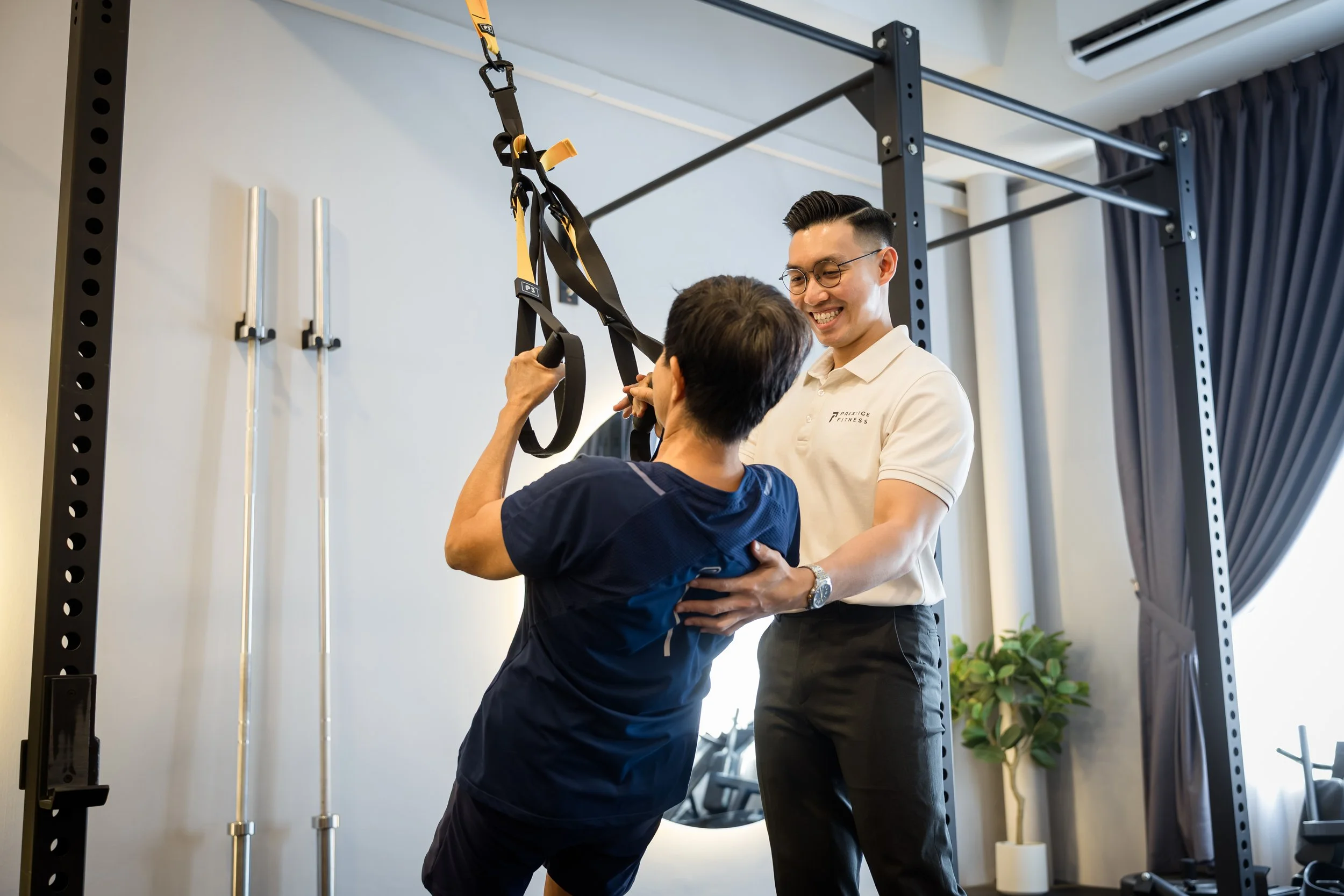 Keith Chung coaching a senior client during a personal training session in Prestige Fitness Ipoh