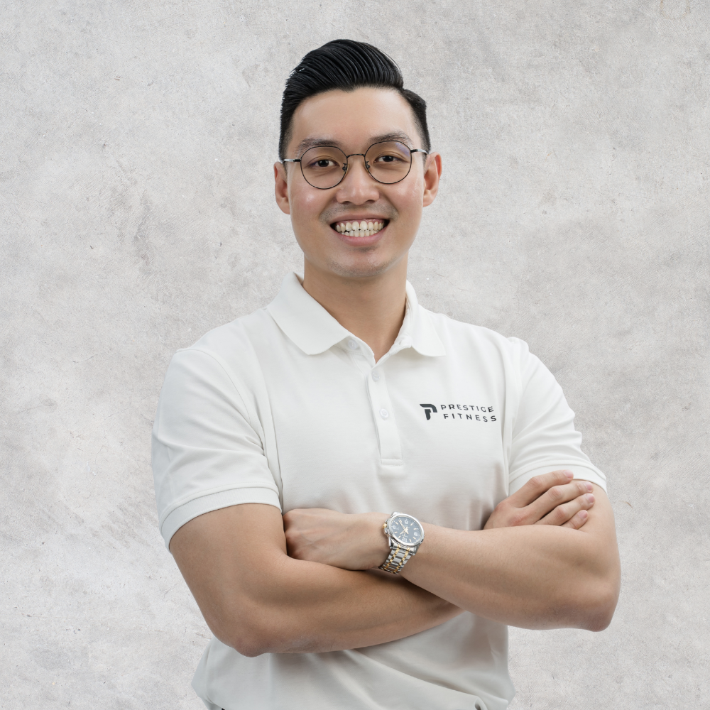 Keith Chung, Founder and Master Trainer at Prestige Fitness, coaching a client through personalised strength training in a private personal training studio in Ipoh, specialising in helping adults and seniors move pain-free and build strength safely.