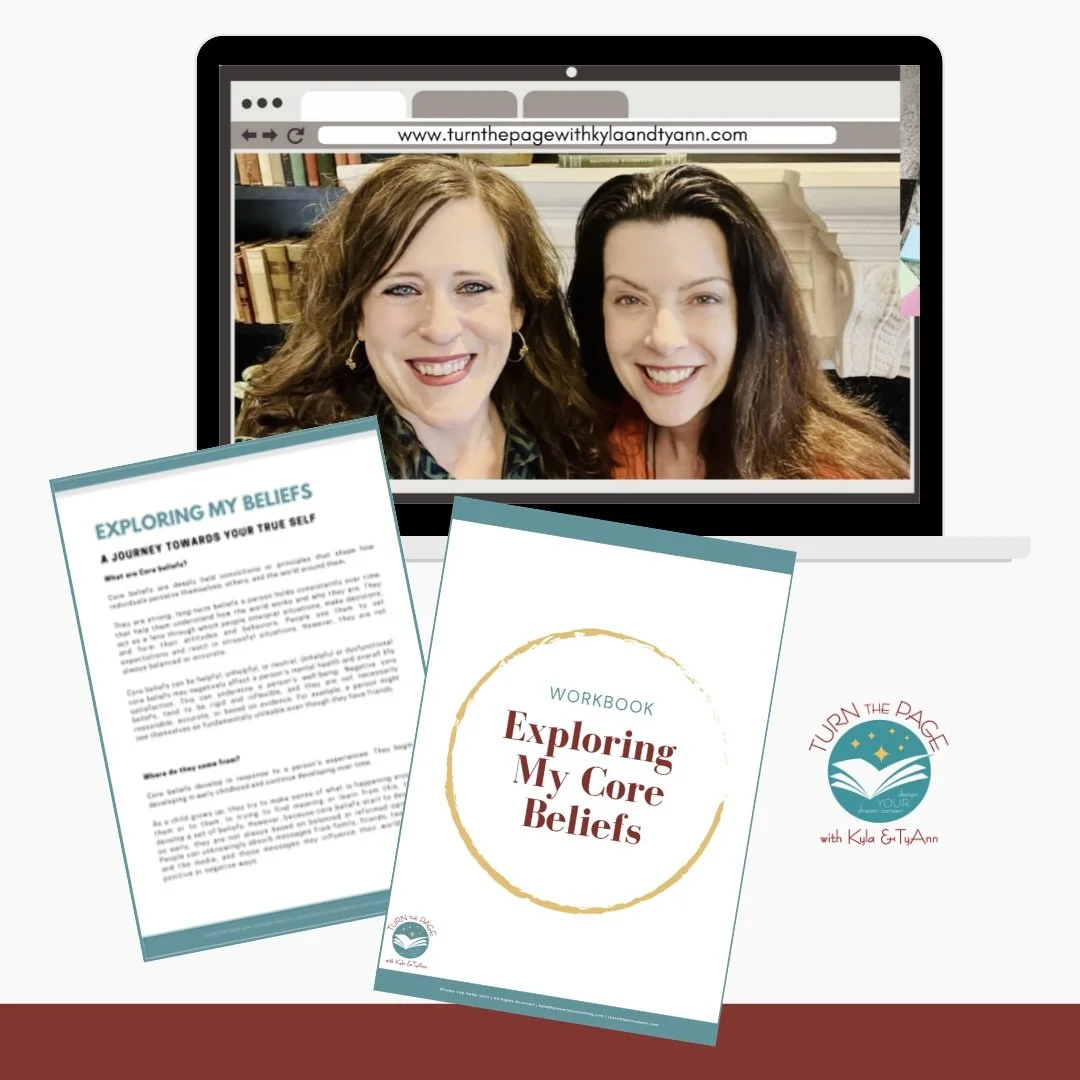 A laptop screen showing two smiling women taking a selfie. In front, there is a workbook titled "Exploring My Core Beliefs," and next to it, a sheet with the heading "Exploring My Beliefs." There is also a logo with the text "Turn the Page with Kyla & TyAnn."