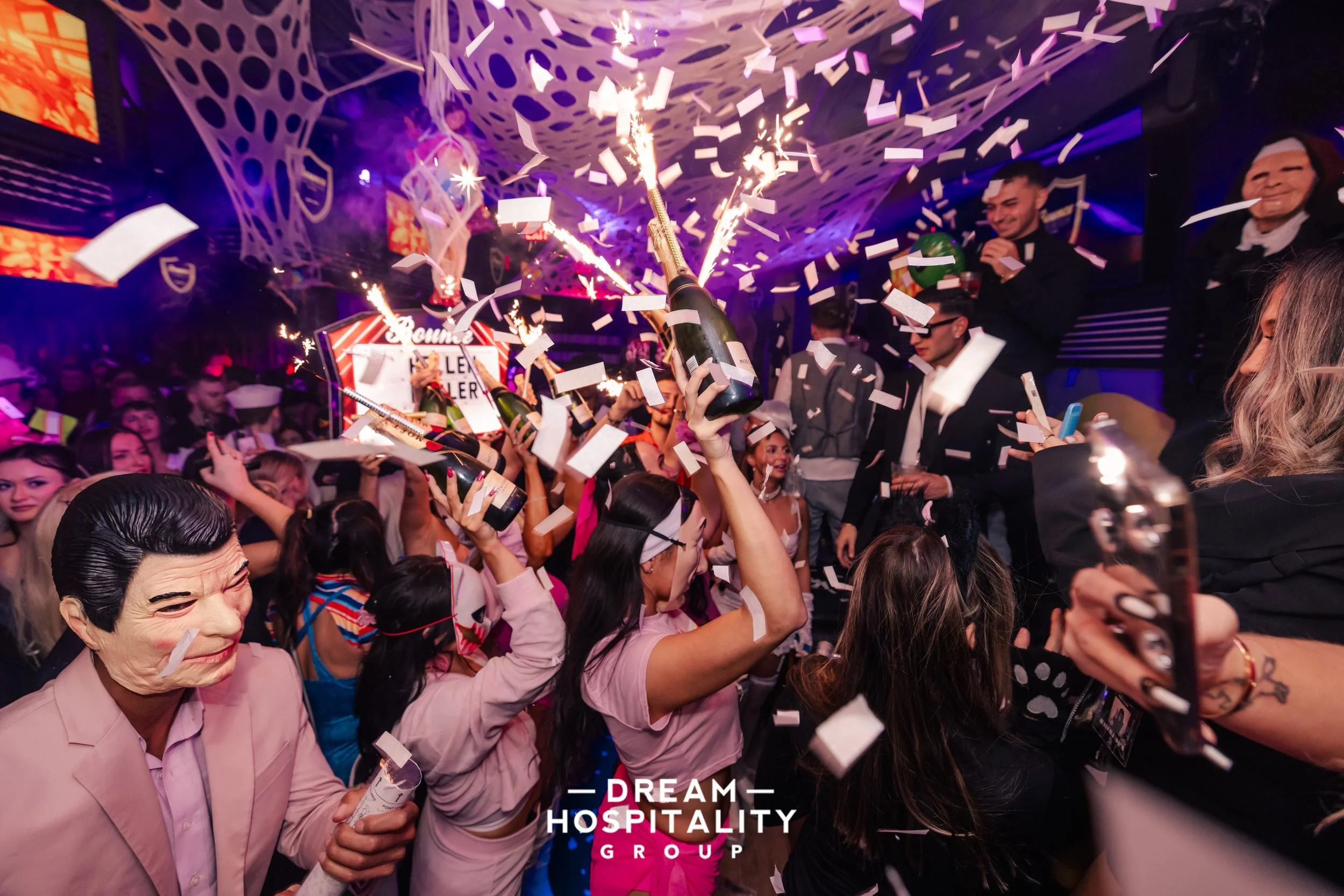 Guests playing interactive games at T-Squared during Halloween celebration