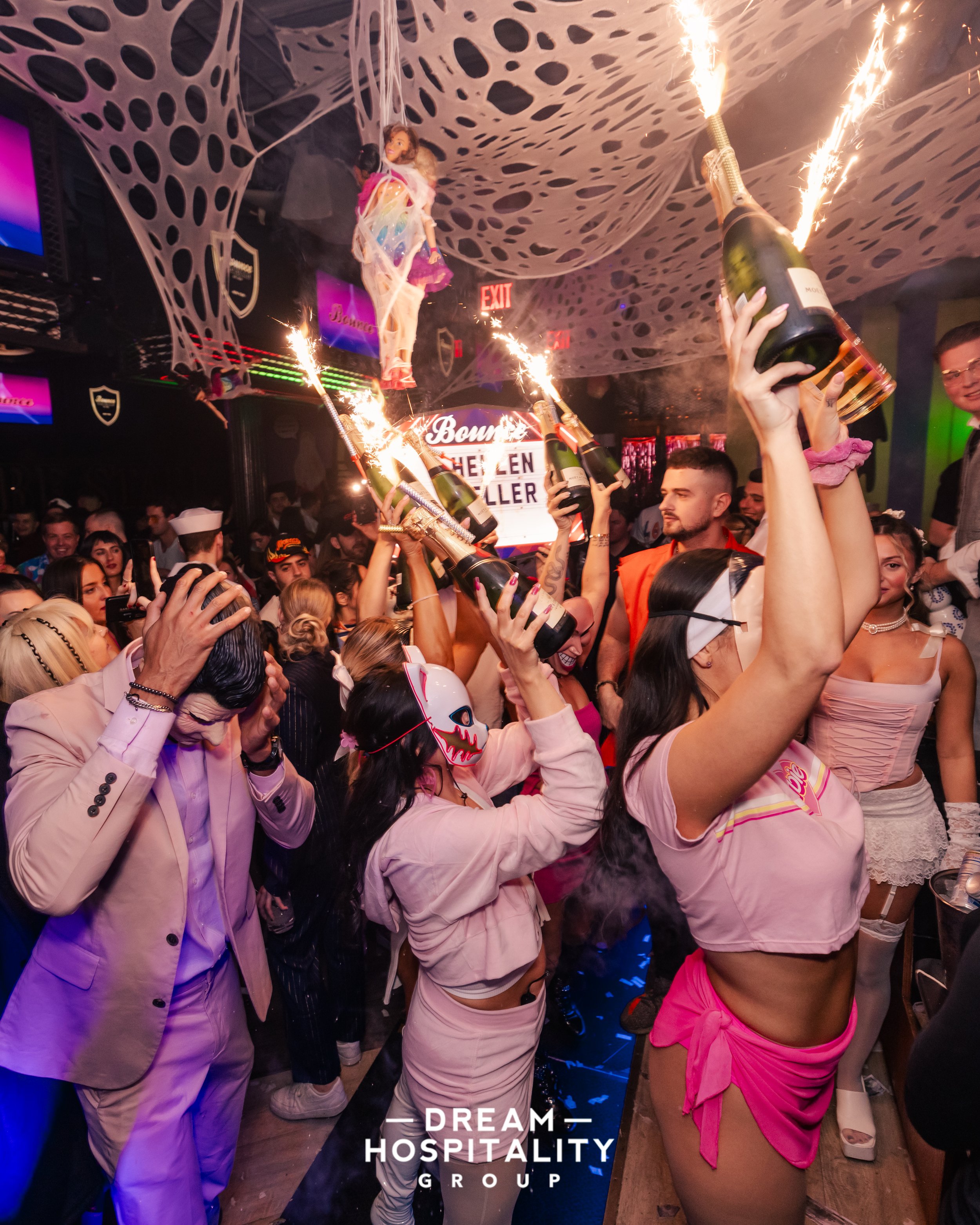 VIP booth and bottle parade during Halloween night at T-Squared Social