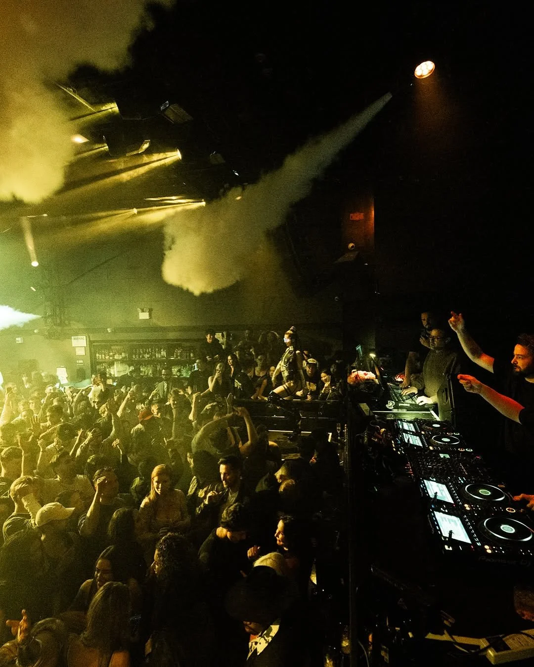 Guests taking photos in front of NEBULA’s Halloween backdrop
