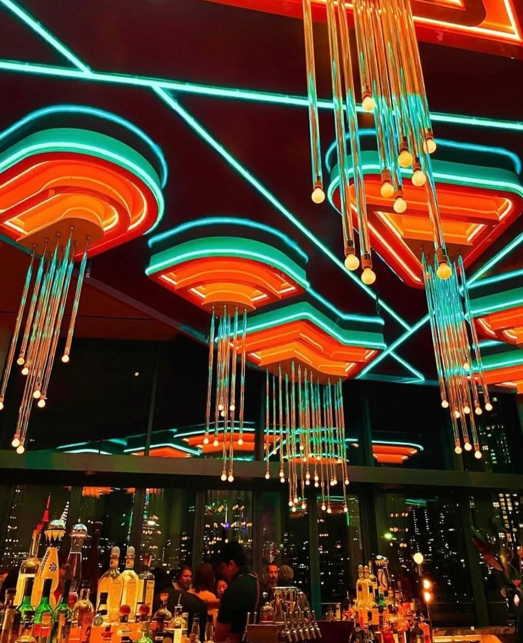 Costumed partygoers posing by windows at Panorama Room