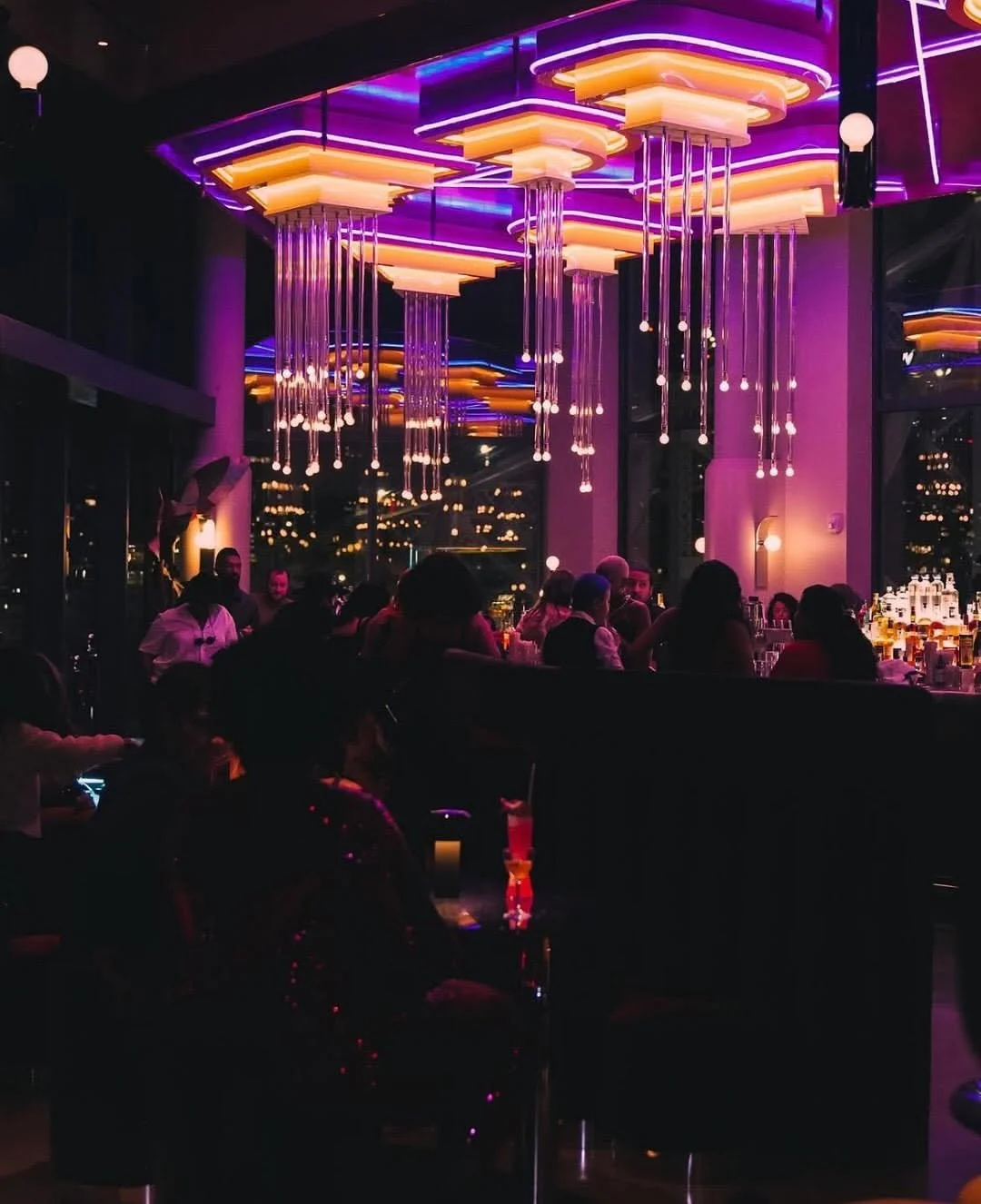 Guests dancing with skyline backdrop at Panorama Room