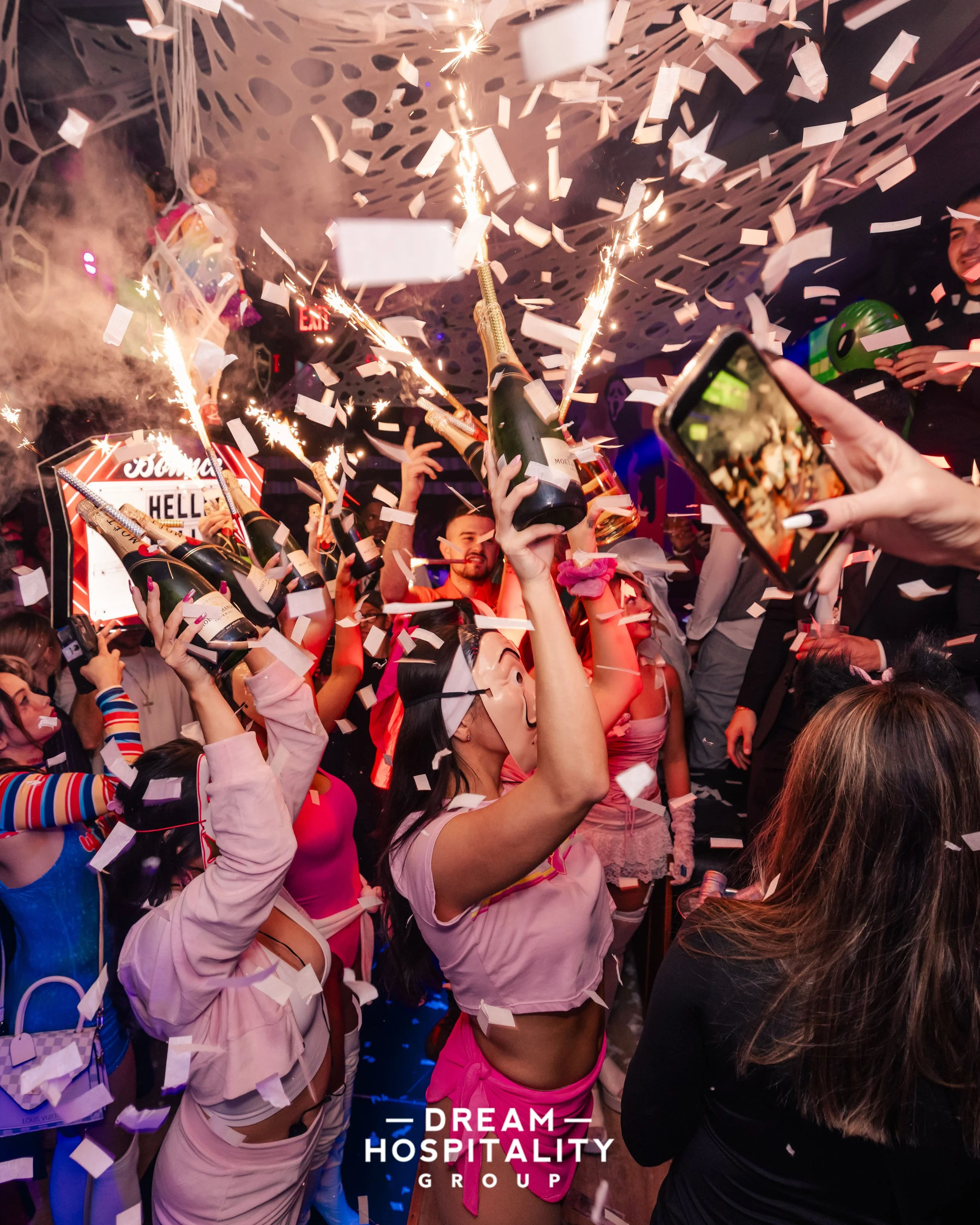 Midtown Manhattan crowd dressed in costumes for T-Squared Halloween party