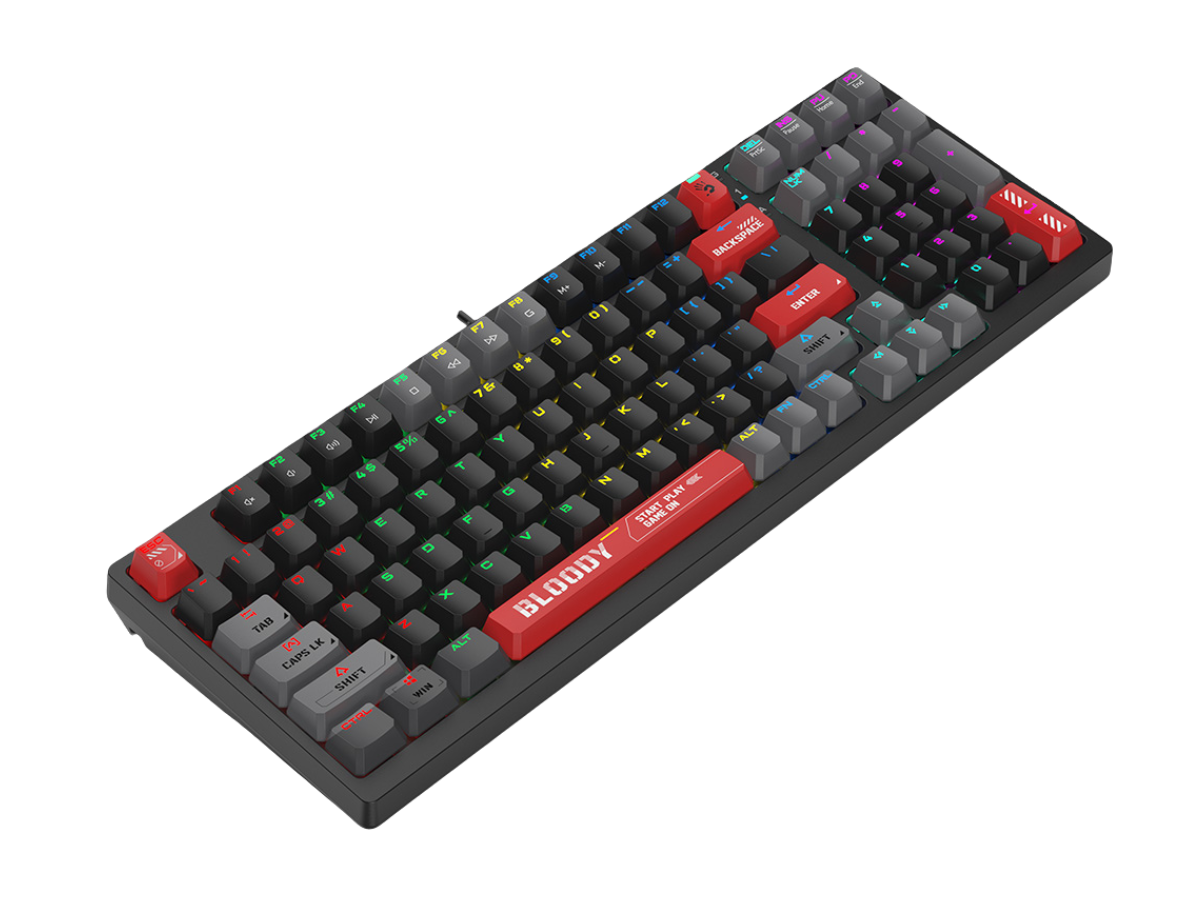 Black mechanical keyboard with colored keys, red escape key, red spacebar labeled with participants, and multicolored backlit keys on a black surface.