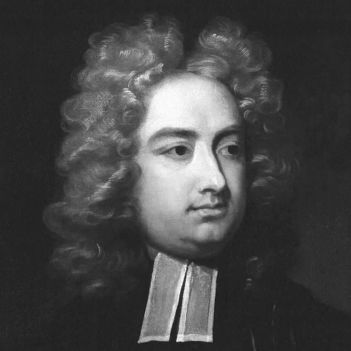 Black and white portrait of a man with long, curly hair, wearing formal clothing with a high-collared shirt.