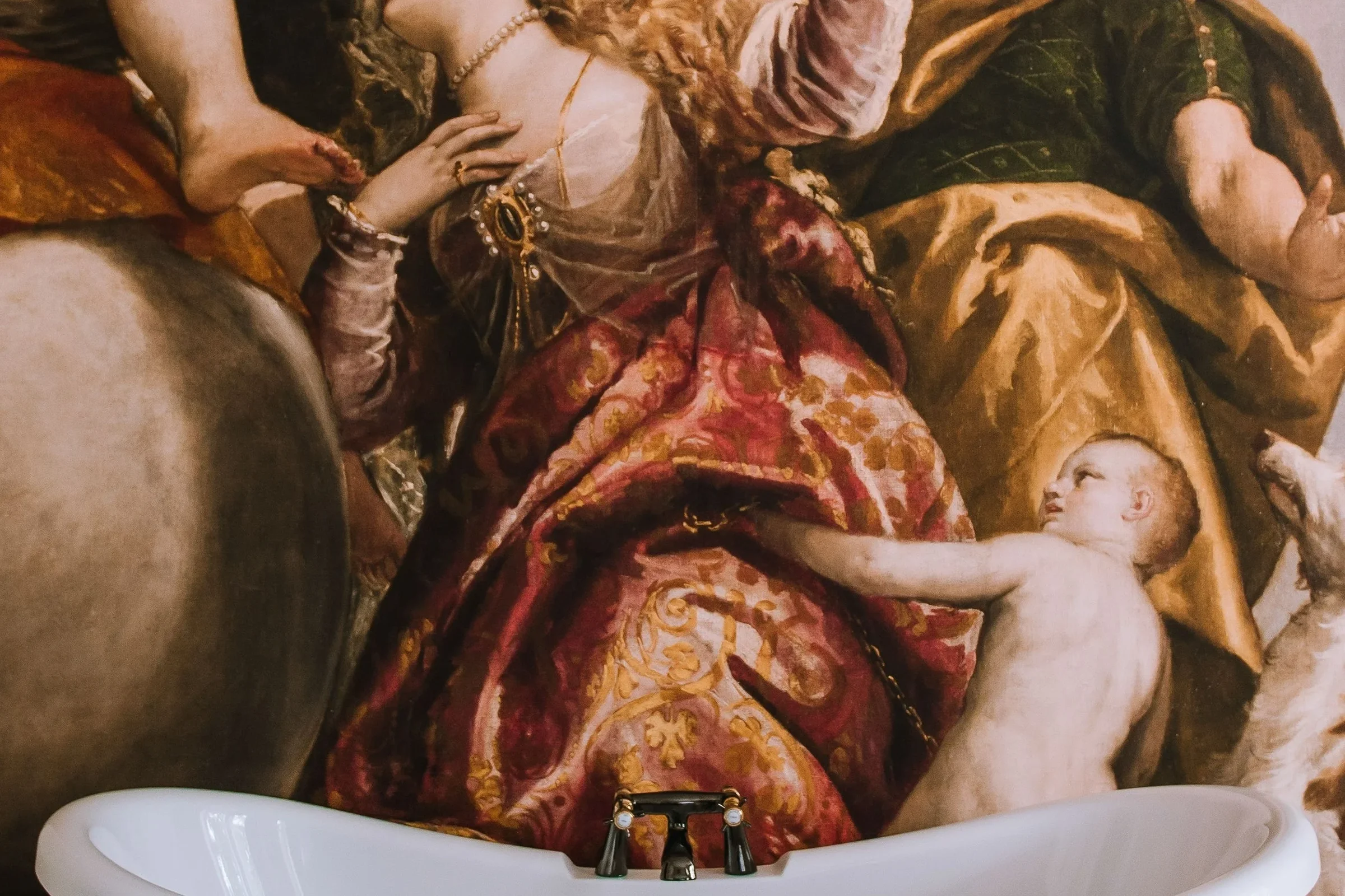 A detailed and colorful classical painting depicting a woman and a young boy, surrounded by ornate, draped fabrics and animals, possibly a lion and a dog.