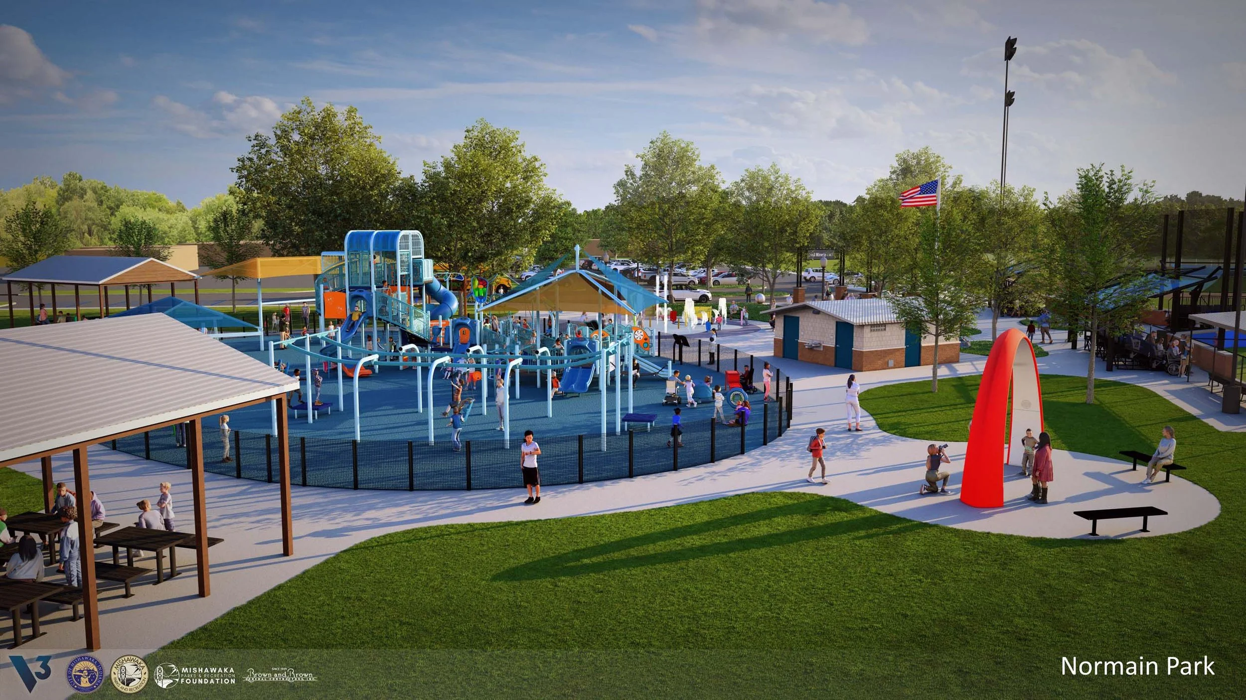 A colorful playground in Normain Park featuring slides, climbing structures, and swings, surrounded by trees and green grass, with people and children playing and relaxing under shaded areas.