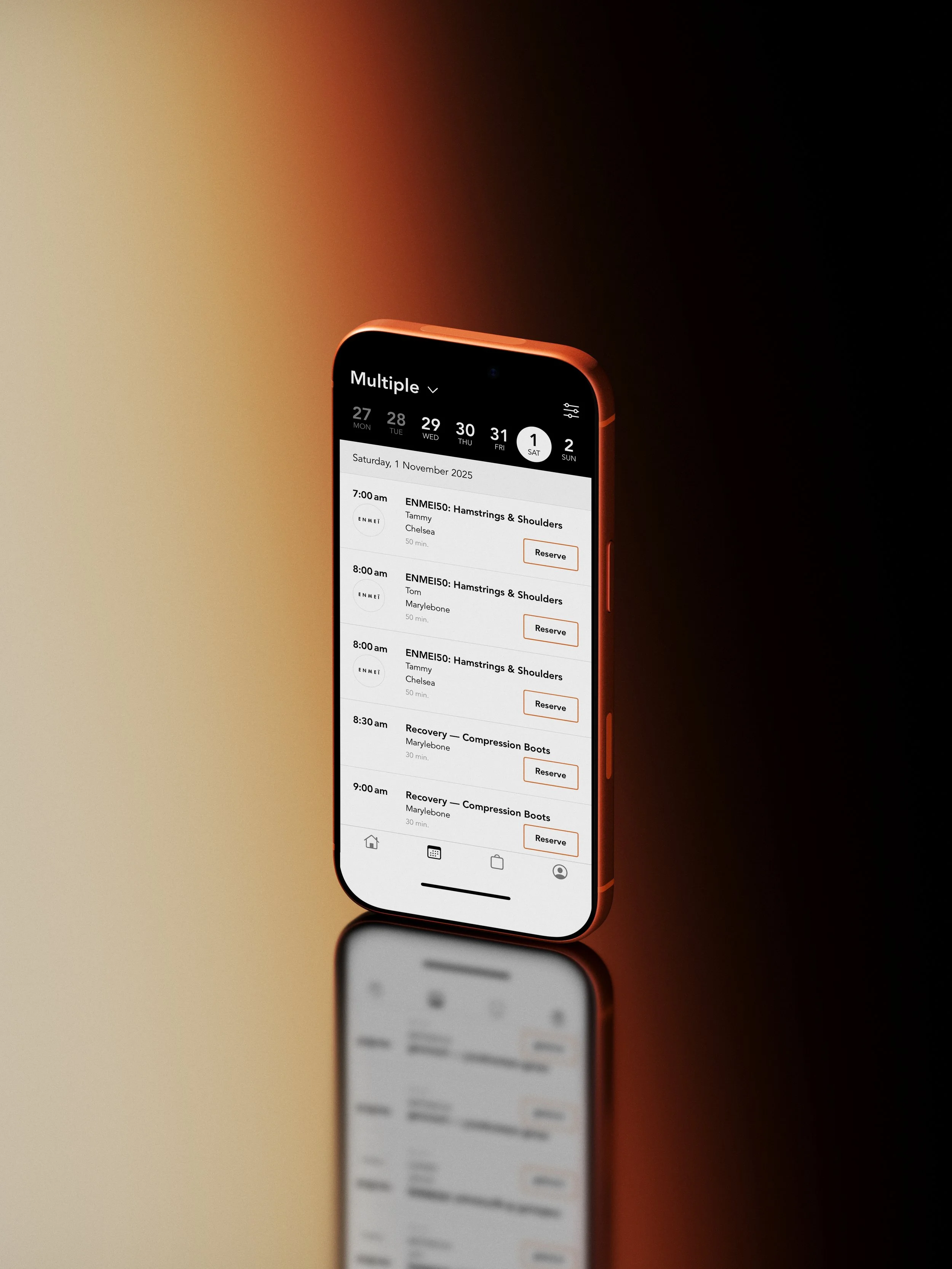 Smartphone displaying a calendar app with scheduled fitness classes and reserve buttons, reflecting on a glossy surface.