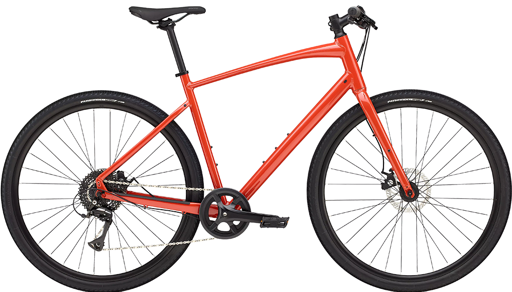 Red mountain bike with black seat and tires, and gear shifters on the handlebars.