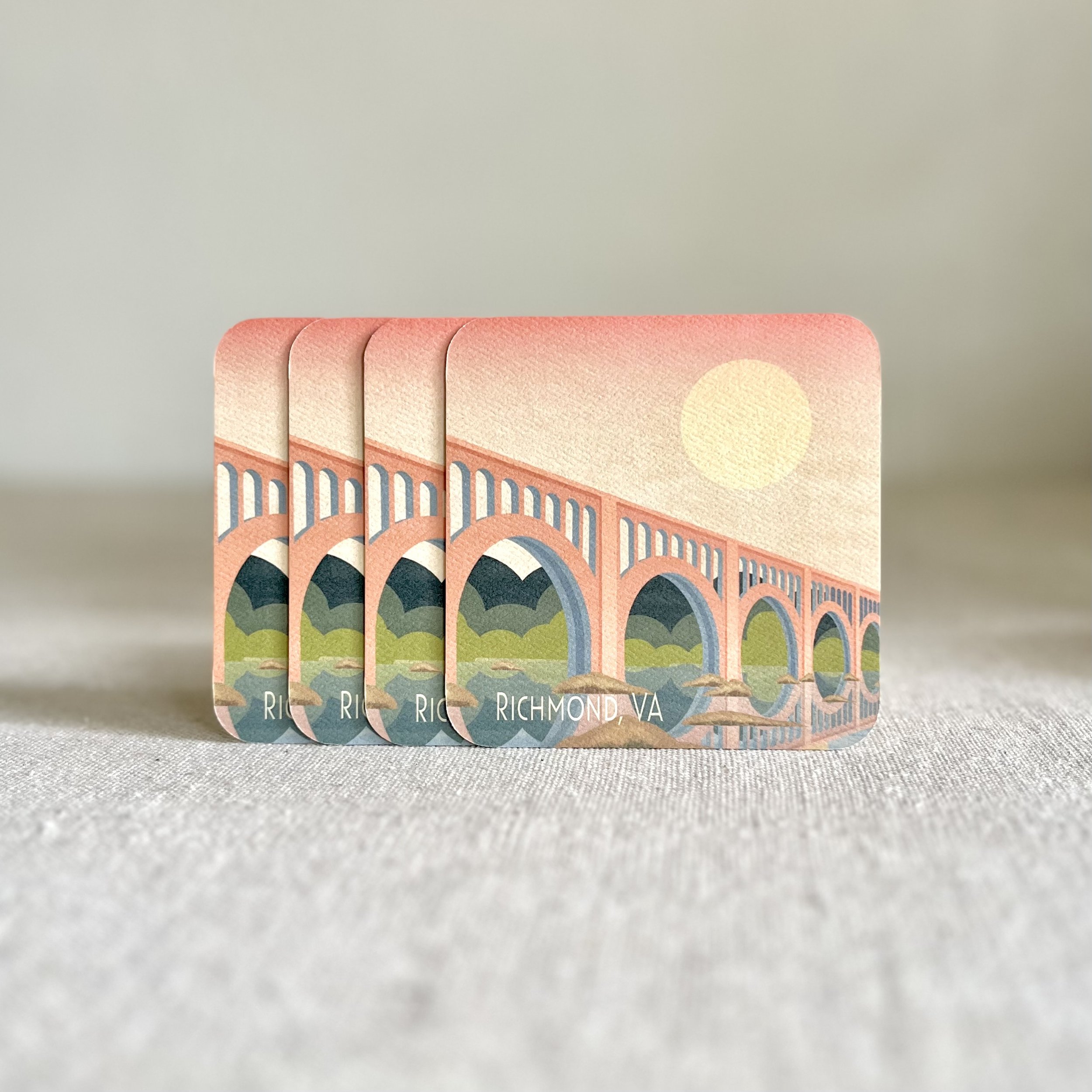 A set of four coasters of the Moon Over Train Bridge artwork on a neutral background.