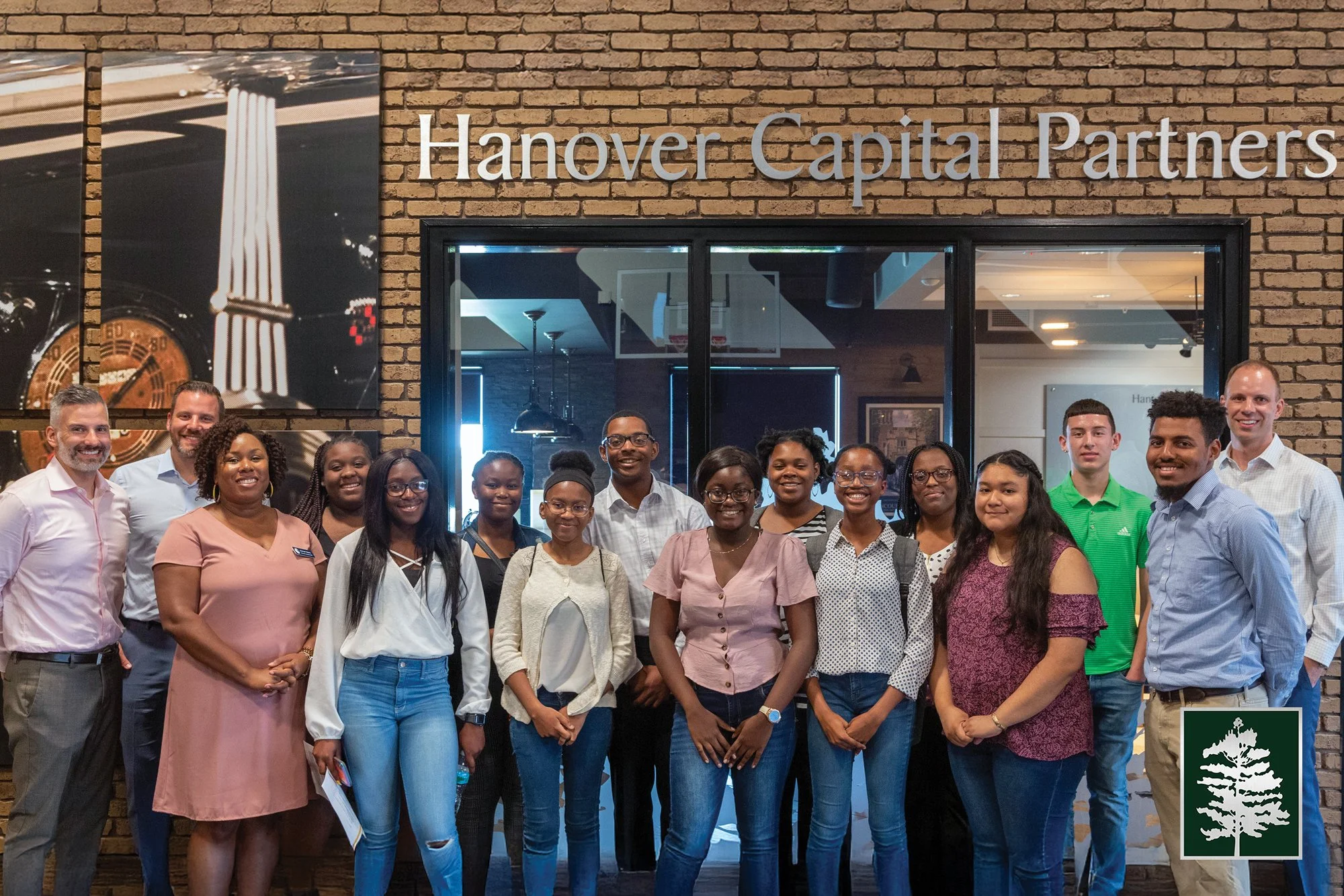 Group of students from Elevation Scholars Program and Hanover Capital leaders shown at Hanover Capital Partners Headquarters.