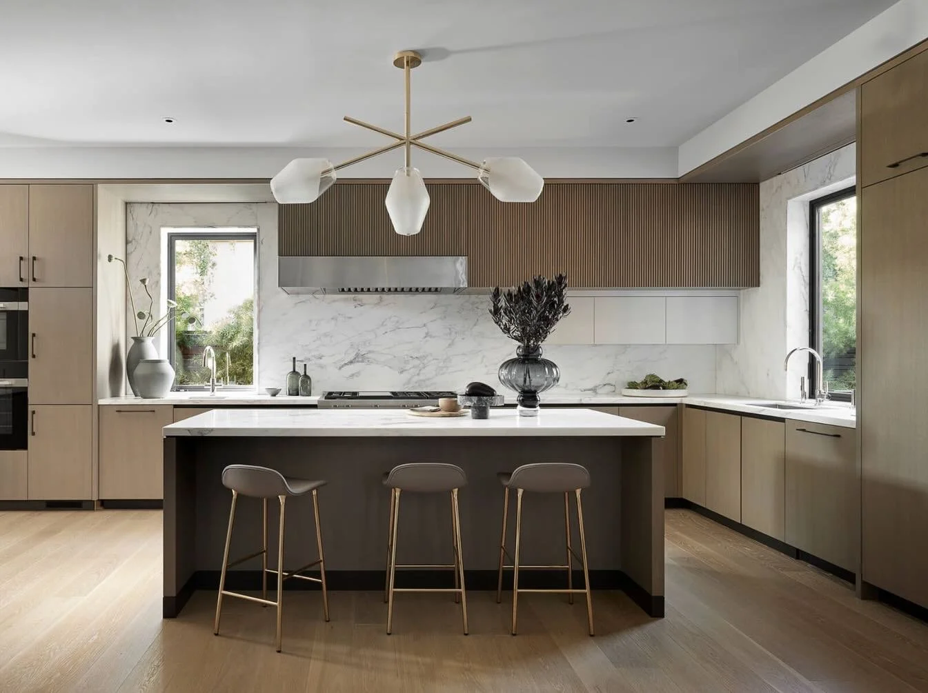 Where wood meets architecture.
From the vertical grain detailing in the kitchen to the exterior cladding, every element was designed to create continuity throughout the home.
Warm, minimal, and built to last.

Builder: K Welton Construction 
Architec