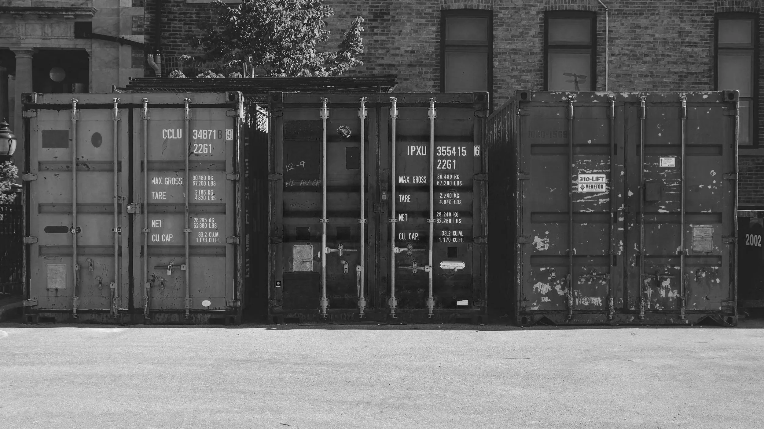 Delivery of shipping containers prepared for modular fitness build
