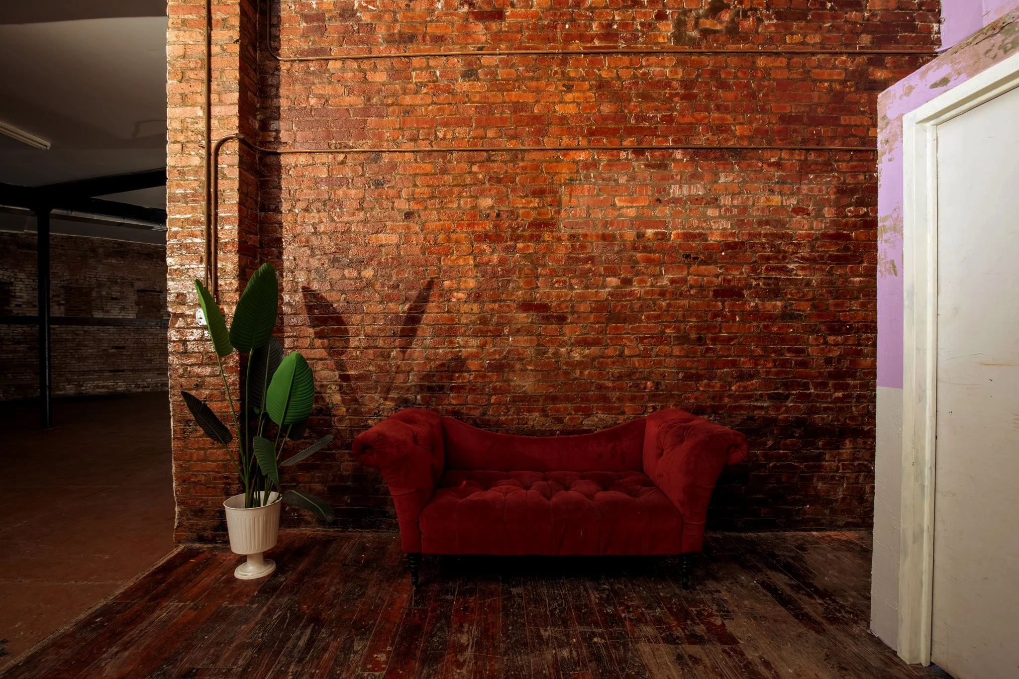 red-love-seat-brick-wall.jpg