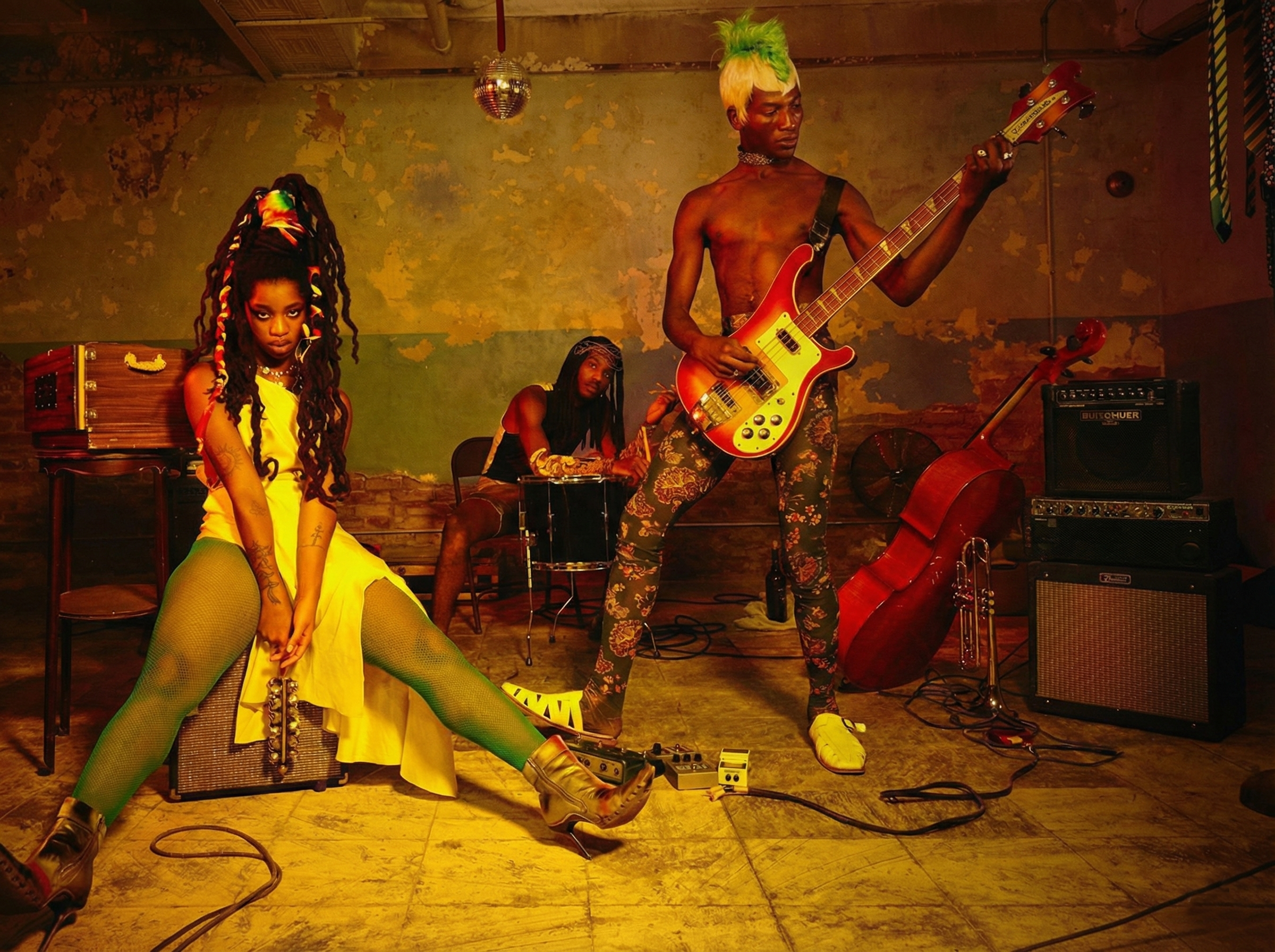 Theophilio's models pose with instruments and amps in the Classroom at Gymnopedie