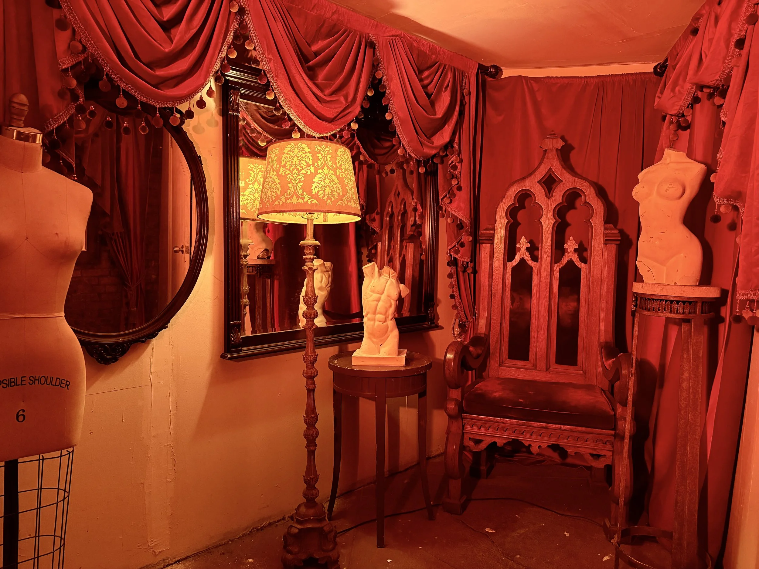 throne-lamp-red-curtains-statues.jpeg