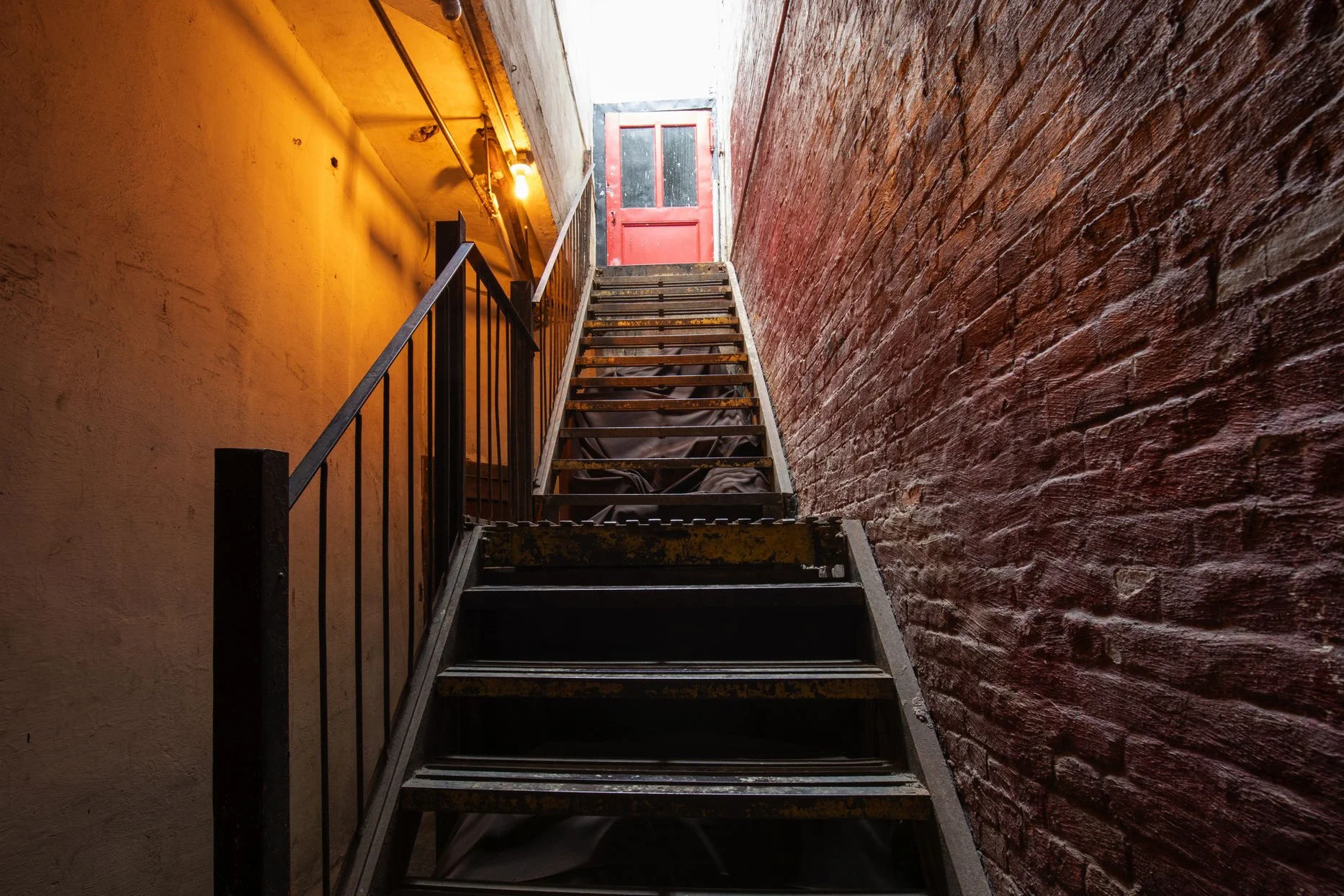 moody-stairwell-brick-metal-warehouse.jpg