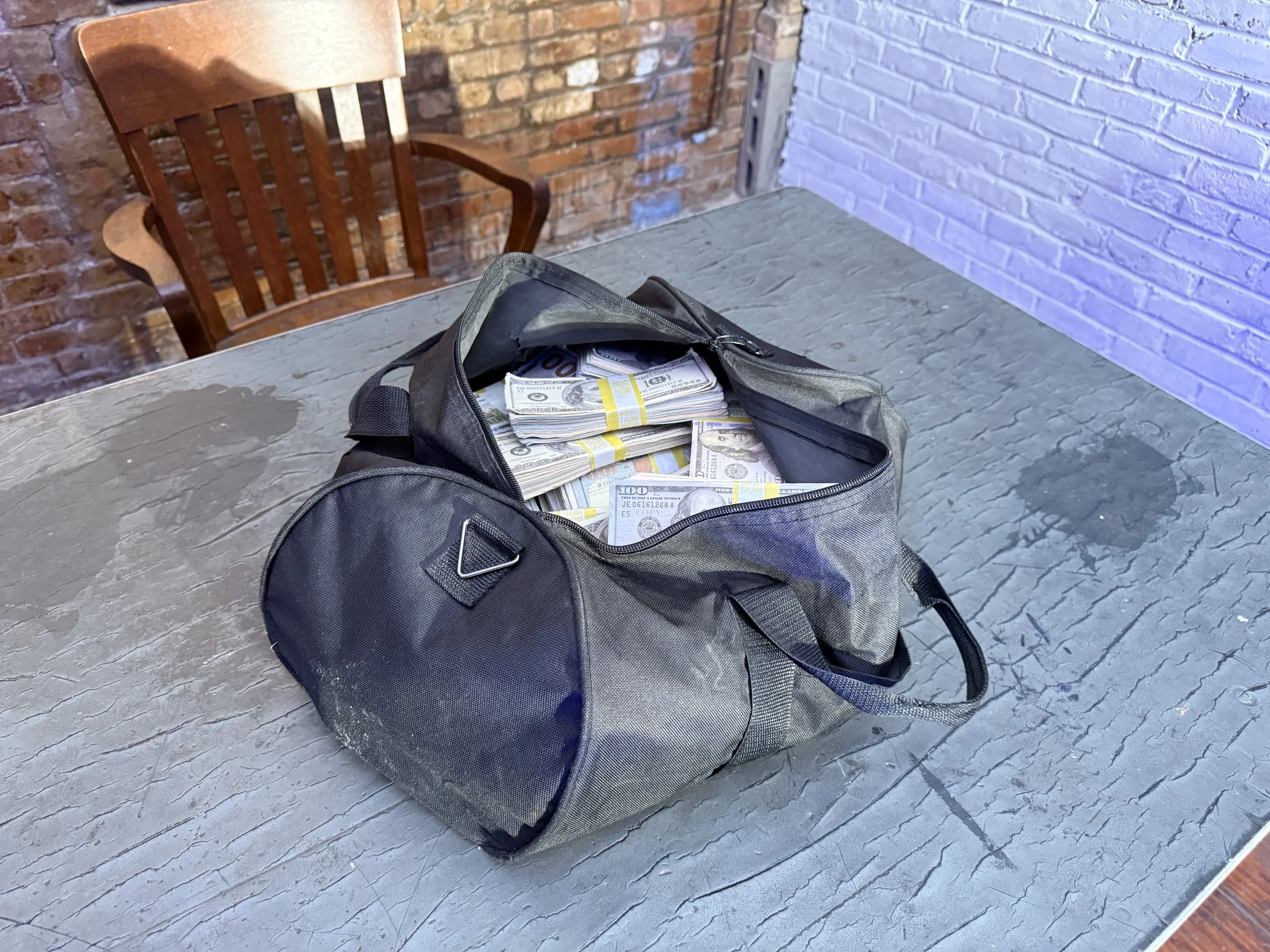 Duffle bag full of prop money