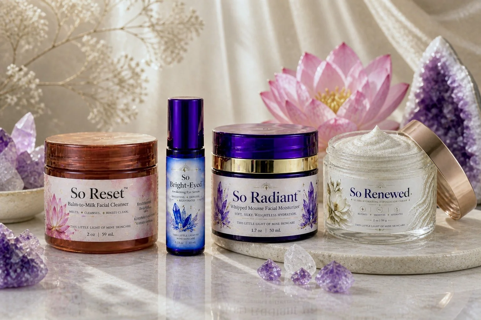 Collection of skincare products including So Reset balm-to-milk facial cleanser, So Bright-Eyed eye serum, So Radiant whipped mousse facial moisturizer, and So Renewed exfoliation cream, with decorative crystals and lotus flowers in the background.
