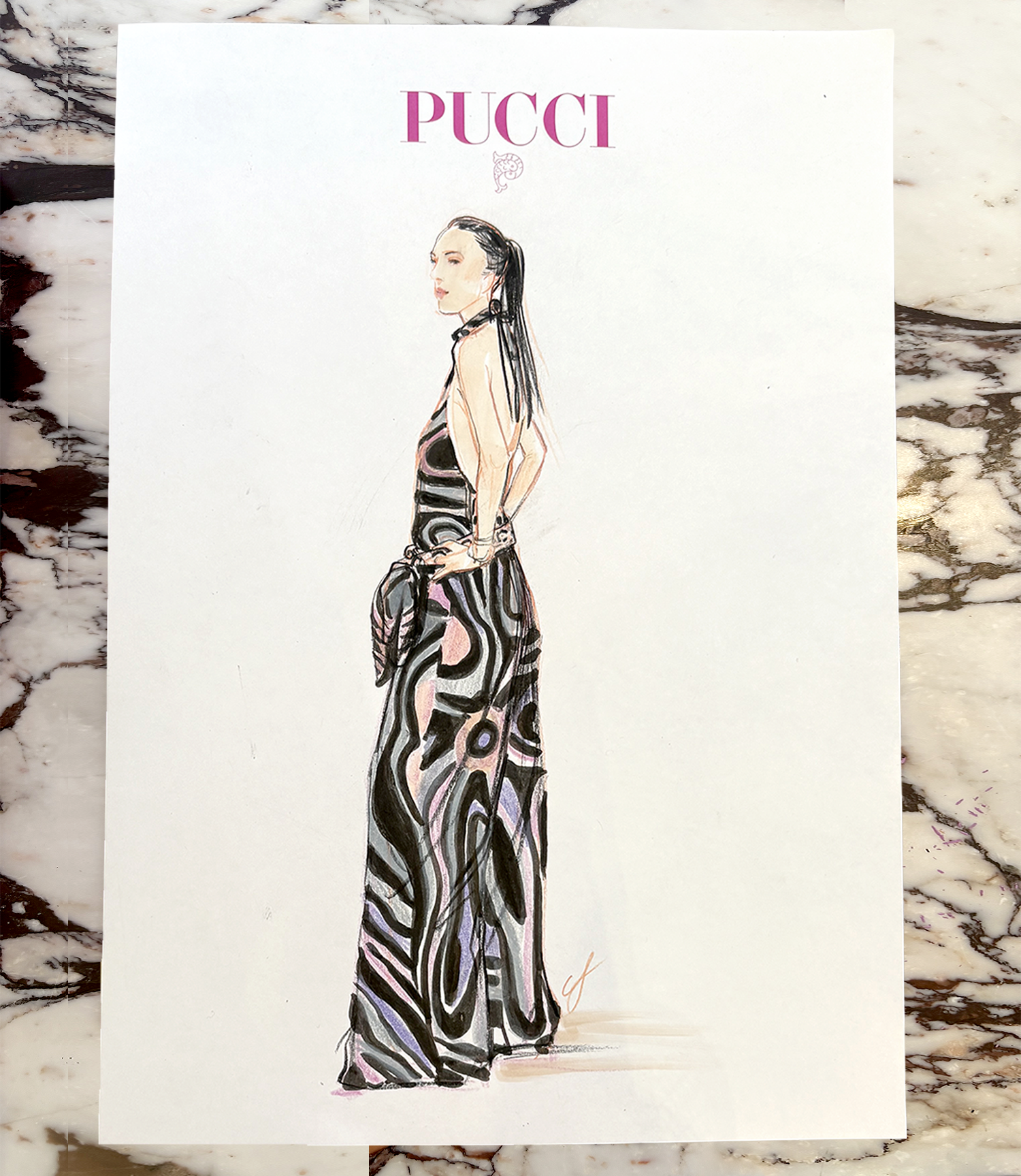 Fashion illustration of a woman in a long, abstract black, pink, and purple patterned dress, standing in profile with hands in pockets. The drawing features detailed facial features and long dark hair, with 'PUCCI' written in pink at the top.
