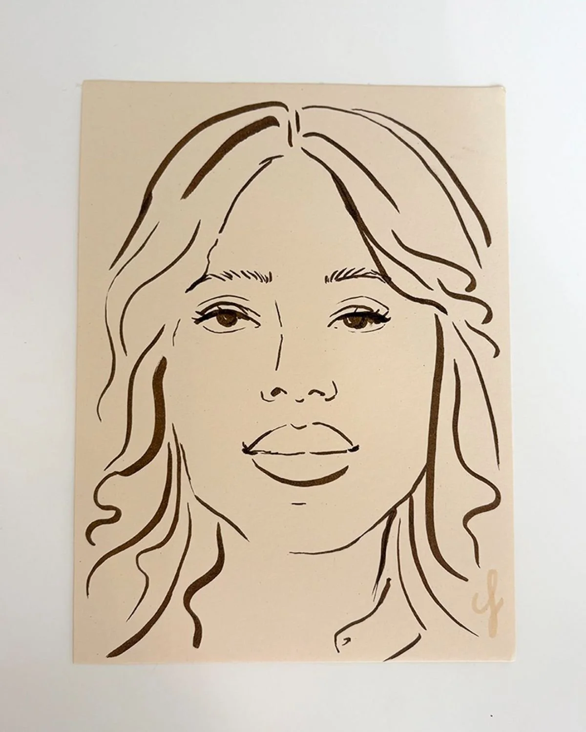Line drawing of a woman with wavy hair and full lips.