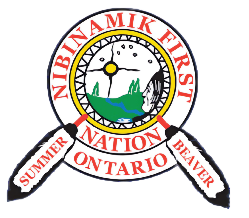 Emblem of the Nibinamik First Nation in Ontario featuring a circular badge with a clock, landscape, and indigenous portrait, along with two paddles labeled 'SUMMER' and 'WINTER' crossing behind it.
