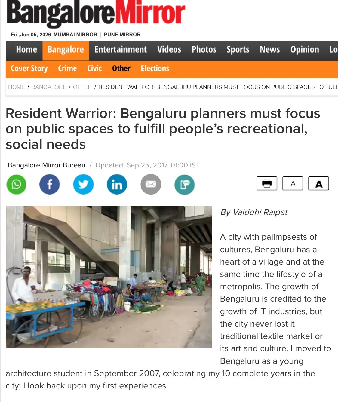 Screenshot of a news article from the Bangalore Mirror titled 'Resident Warrior: Bengaluru planners must focus on public spaces to fulfill people's recreational, social needs', featuring an image of a street market in Bengaluru with vendors and pedestrians under a modern elevated structure.
