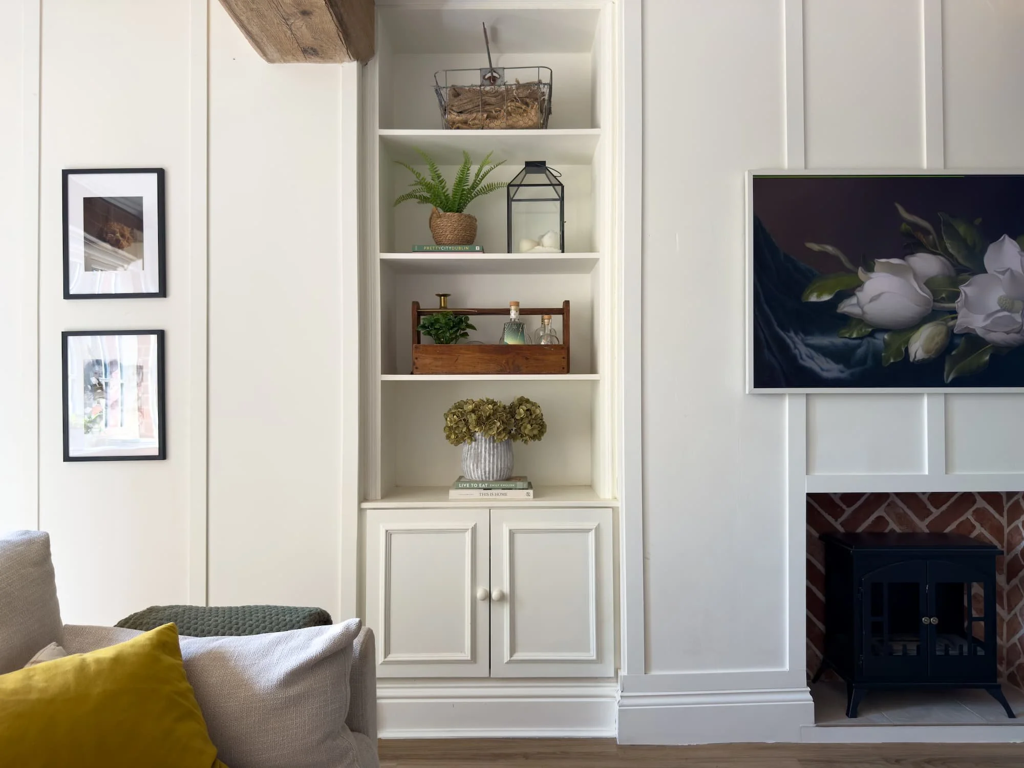 Bespoke alcove joinery and open shelving flanking a period fireplace