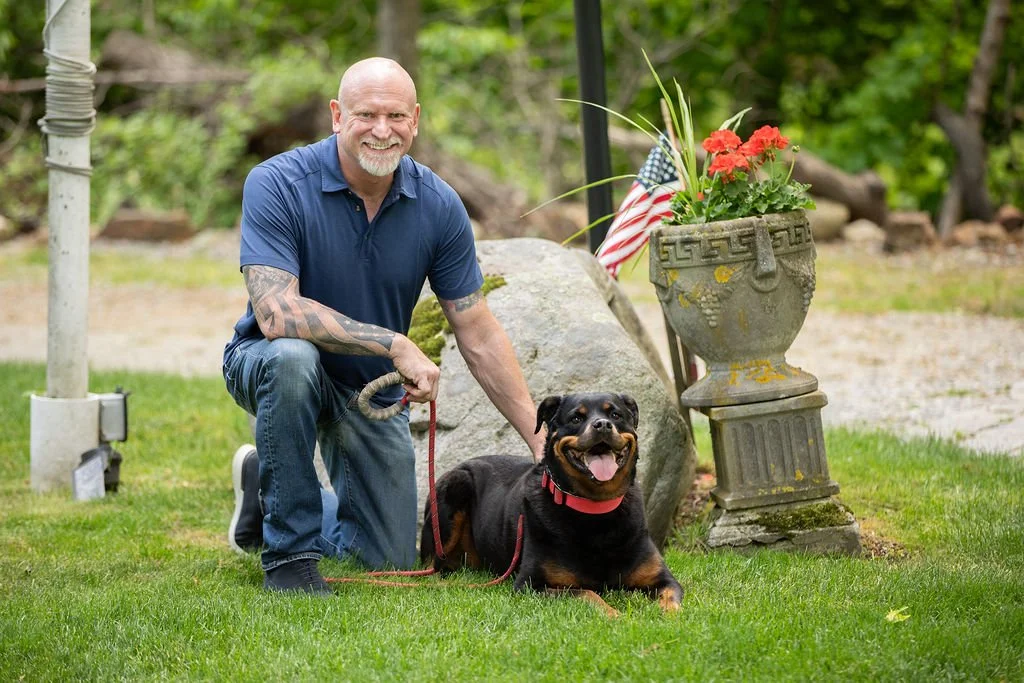 Mike Nolan, Founder & President of Military Talent Connectors with his Rottweiler dog Stella at Veteran's Memorial Park