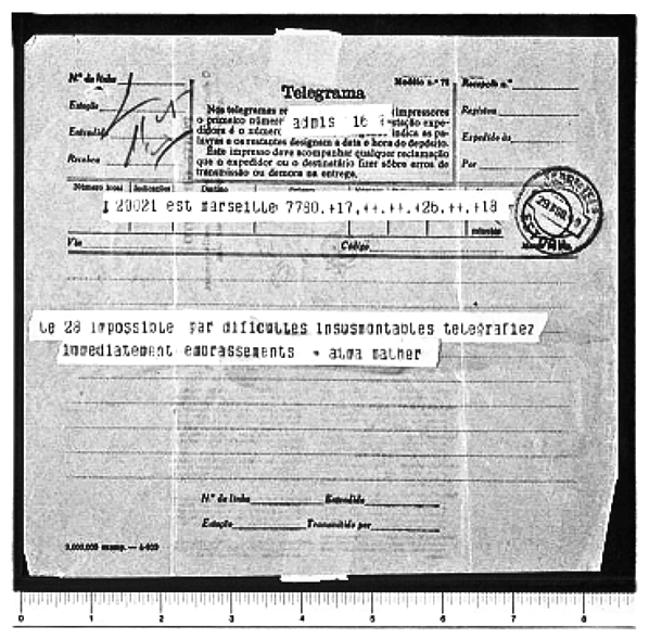 Black and white image of a vintage telegram with handwritten and typed text, circular date stamp, and spacing ruler at the bottom.