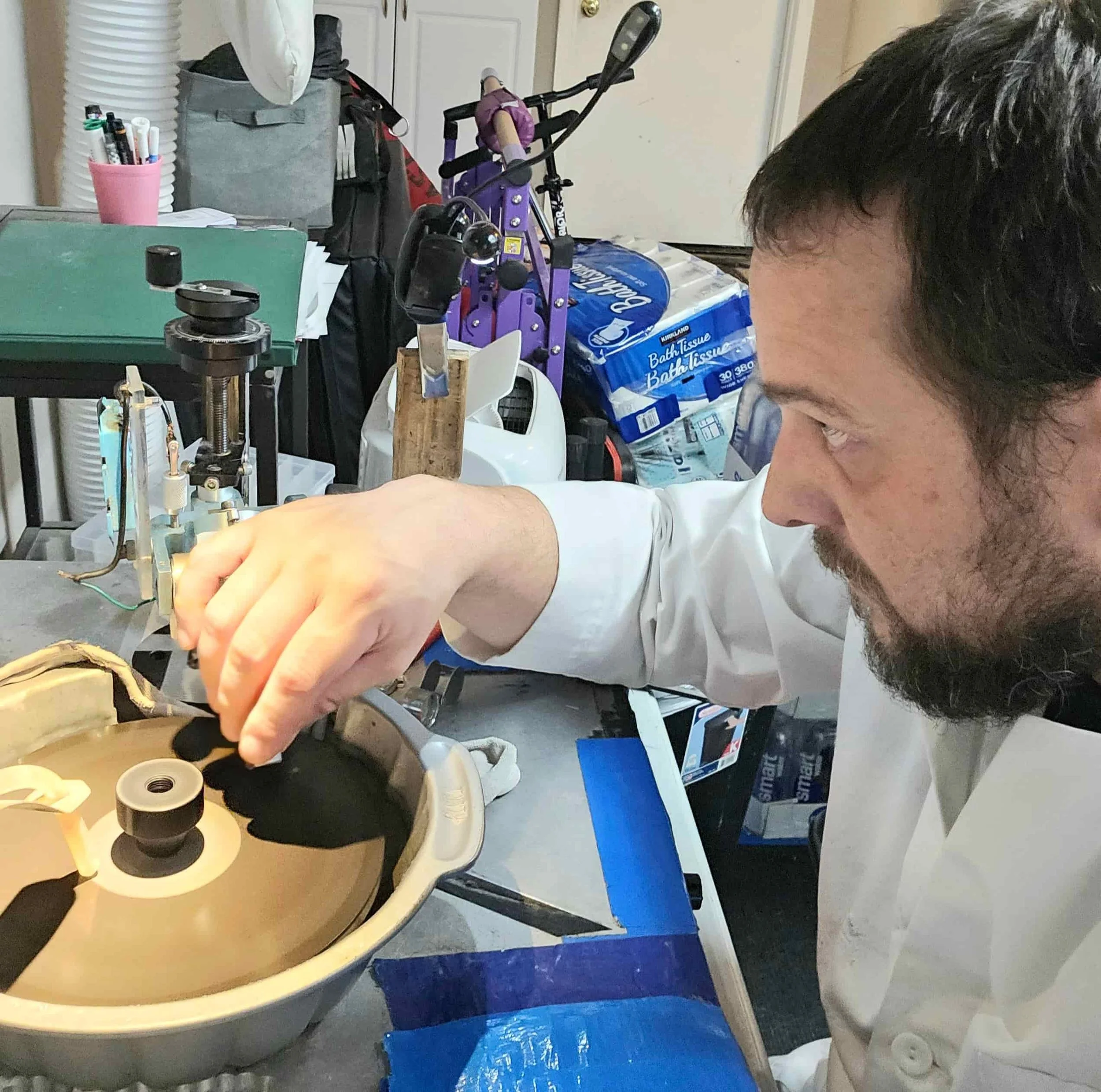 Ian Perry of The Lapidary Office faceting a stone on his custom machine.