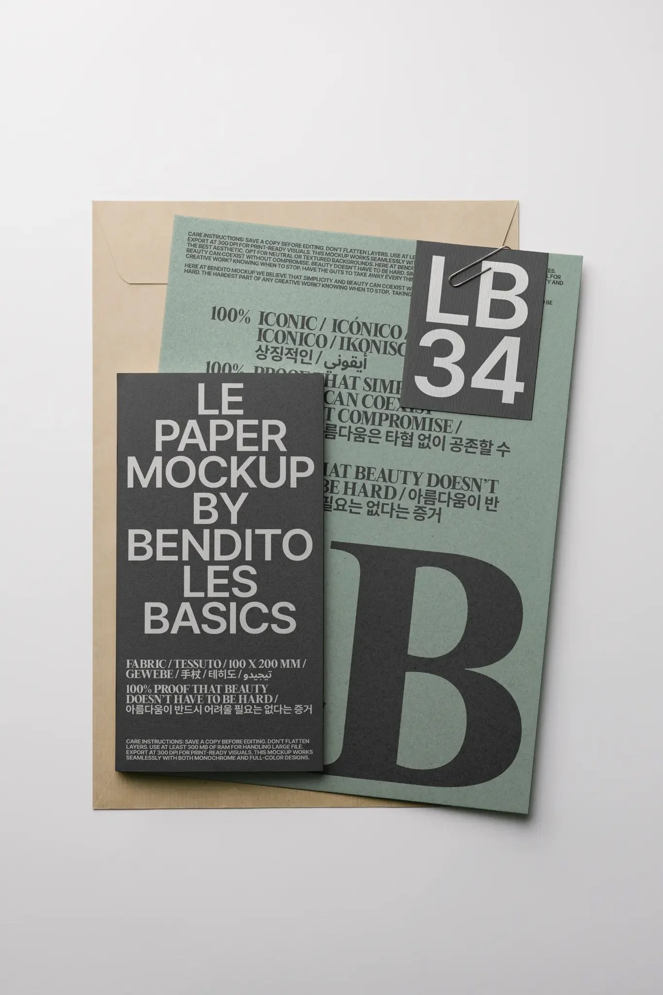 Eine Design-Mockup-Übersicht auf Papier, bestehend aus einen schwarzen und einem grünen Blatt, festgeheftet mit einer Büroklammer, auf weißem Hintergrund.