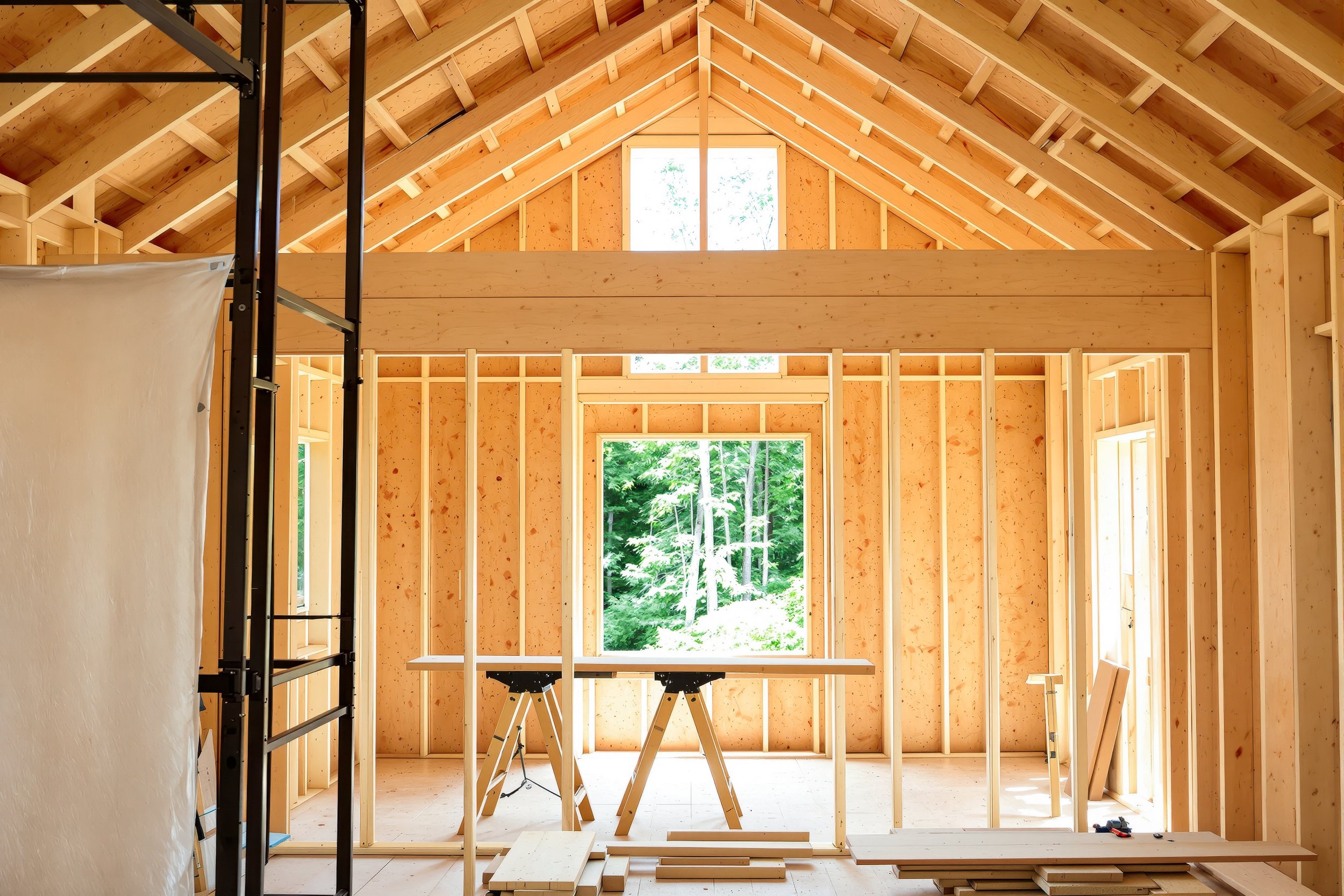vecteezy_the-timber-skeleton-of-a-new-residential-build-shows-exposed_80696934.jpg