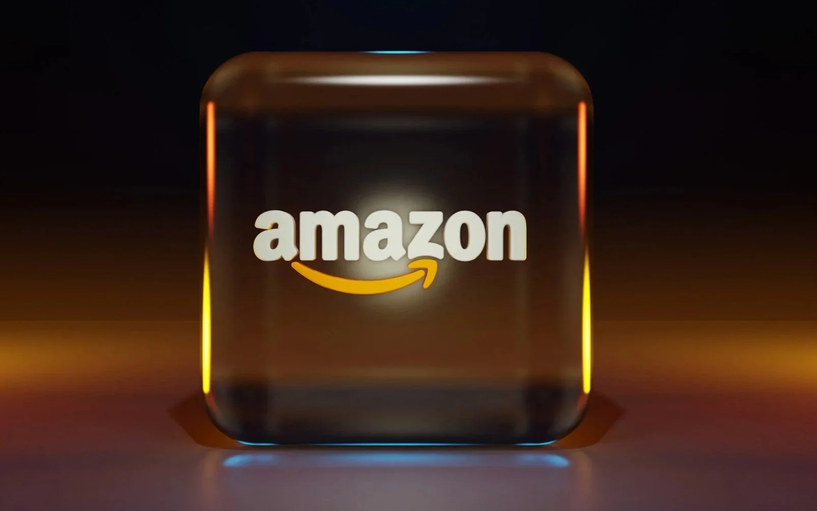 Amazon logo illuminated on a glass cube with colorful lighting effects.