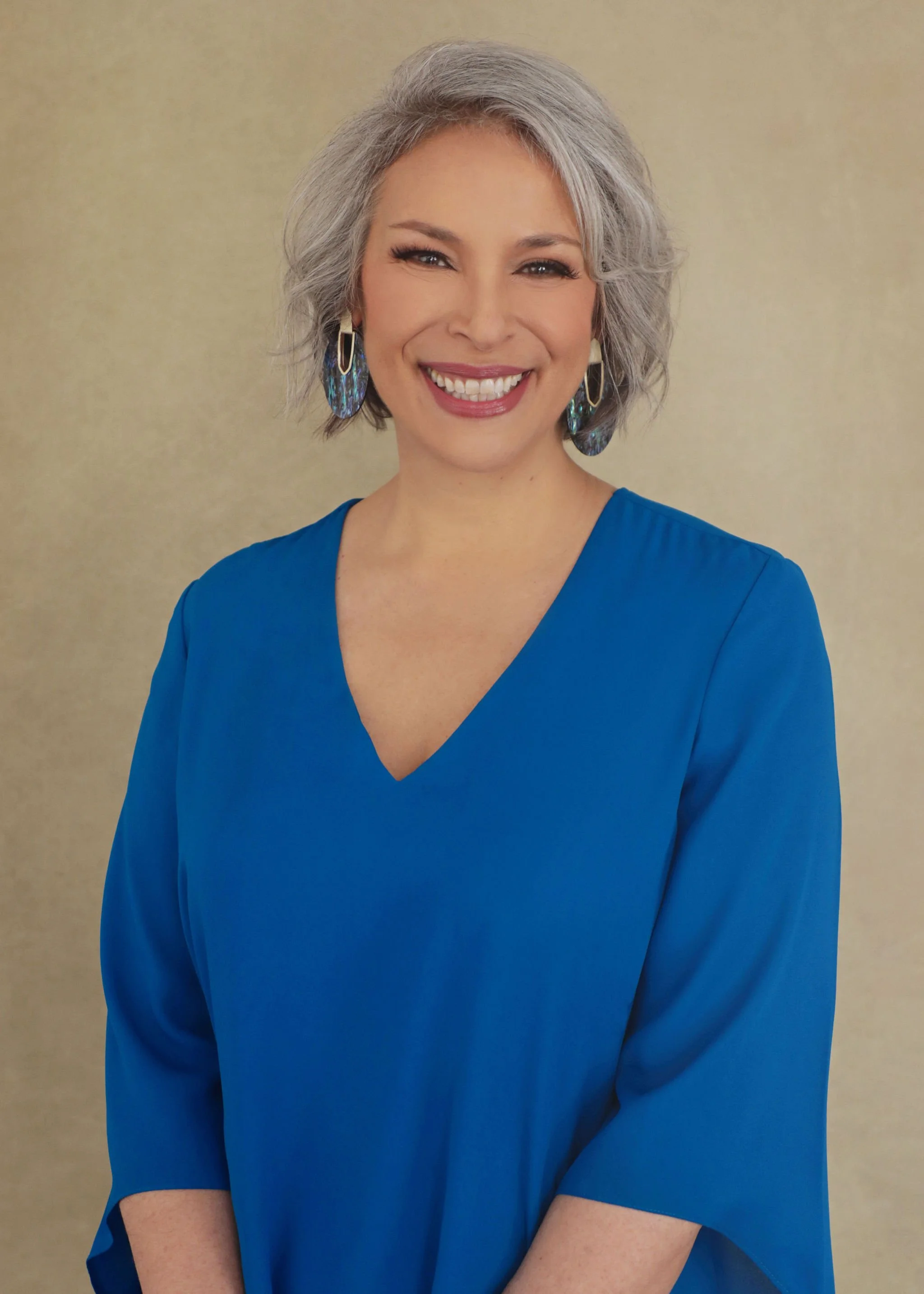 headshot of Joanna wearing a blue blouse