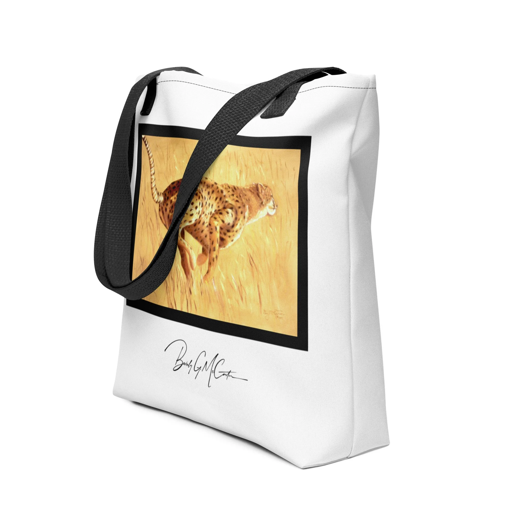 Polyester tote bag with Need for Speed oil print by Beverly G. McCarter, dynamic cheetah in golden grass evoking survival energy.