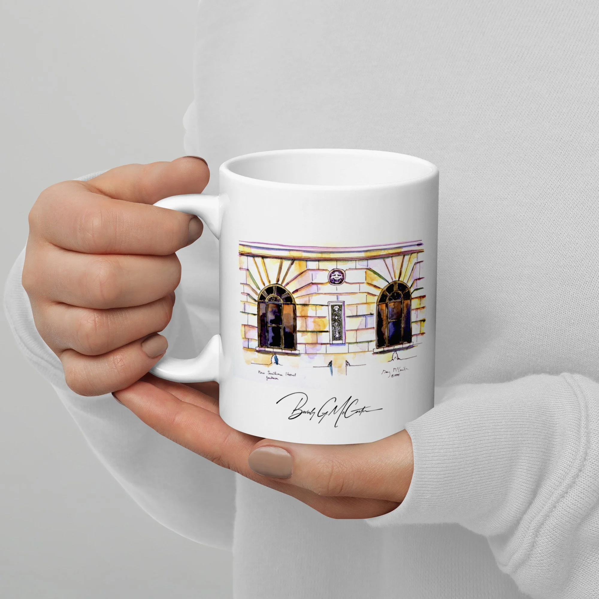11 oz white ceramic mug with New Southern Hotel watercolor wrap by Beverly G. McCarter, Jackson TN landmark in translucent glow.