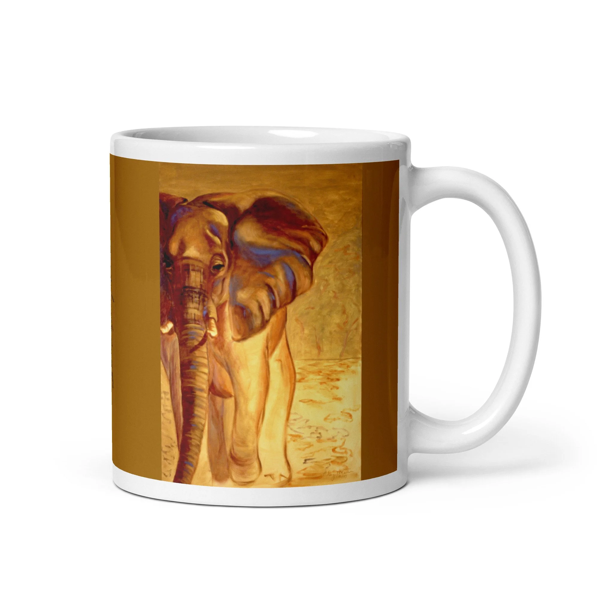 11 oz ceramic mug with Almost Gone oil wrap by Beverly G. McCarter, elephant in golden light on ochre background.
