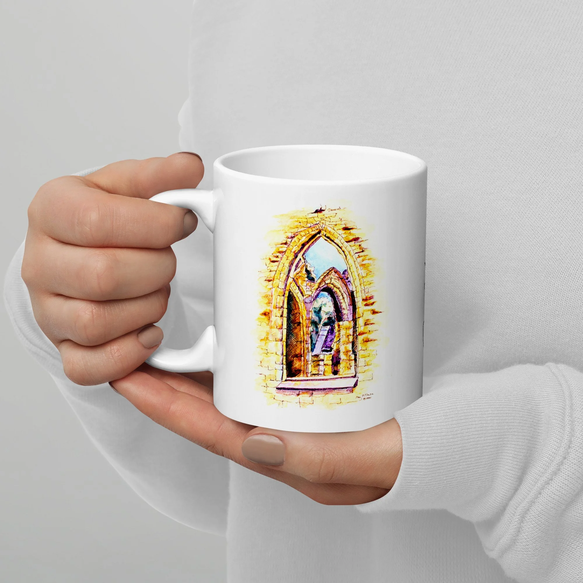 11 oz white ceramic mug with Tintern Abbey watercolor wrap by Beverly G. McCarter, sunlit arches and ivy on Welsh abbey ruins.